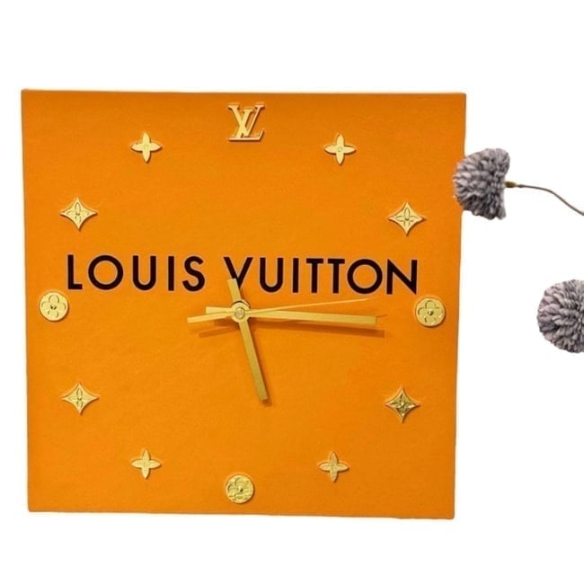 Louis Vuitton Decorative Box/Monogram Custom Wall Clock: • Louis Vuitton • Custom Wall Clock • Gold Tone Hardware • Monogram Pattern • Front Logo • Box Designed • 12" x 12" (in) • Shape: Square • Makeup/Diffusion