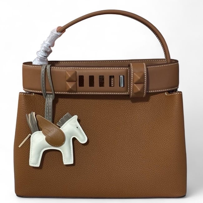 Hermes Brown/Silver Medor Beaute Bag & Original Box: • Hermes • Style: Medor • Color: Brown • Hardware: Silver Tone • Closure: Front Hook Closure • Interior: Zip Pocket, Slip Pocket • Carry Style: Top Handle • Dim