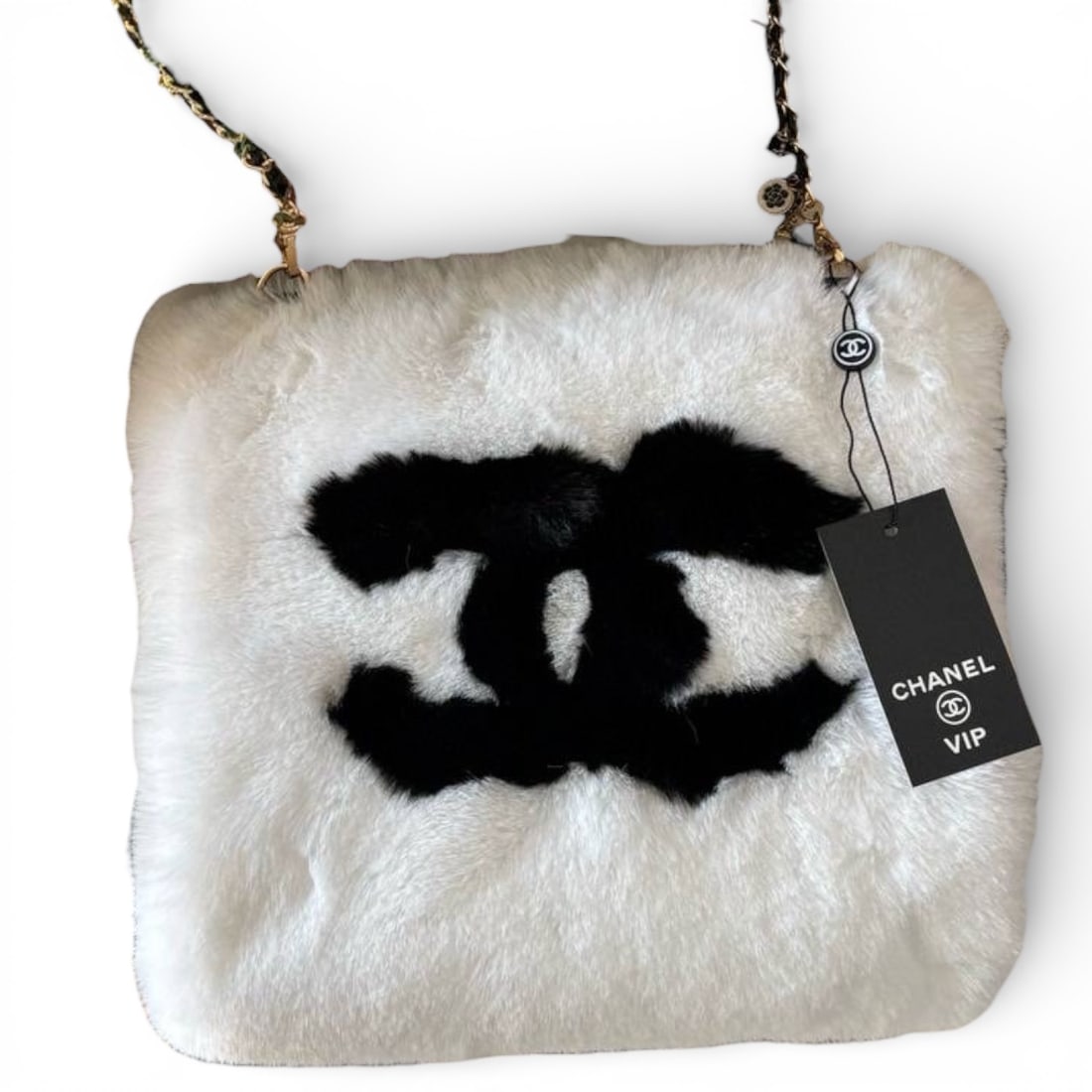 Chanel Rare White/Black Plush Muff (Handwarmer) U.L Beaute Bag: • CHANEL • Muff (Hand-warmer Bag) • Collector's Piece • White • Plush. • Trim/Accents: Black. • Front CC Logo. • Charm Decorated Intertwined Leather Chain Strap