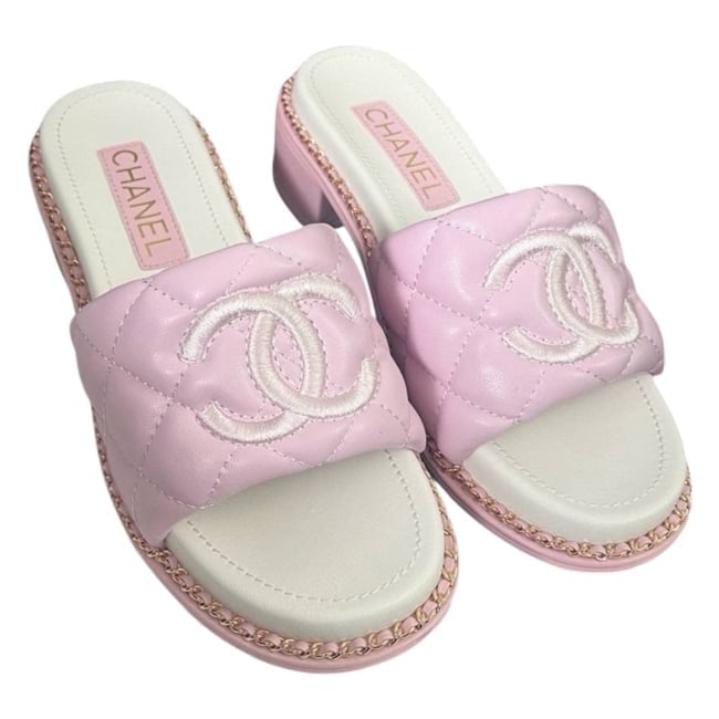 CHANEL Pink/Gold Intertwined Leather Chain Strap Detailed 25S U.L Sandals: • CHANEL • 25S • Uniform Line • Sandals • Pink • Quilted Pattern • Gold Tone Hardware • Intertwined Leather Chain Strap Detail • Top Logo • Availa