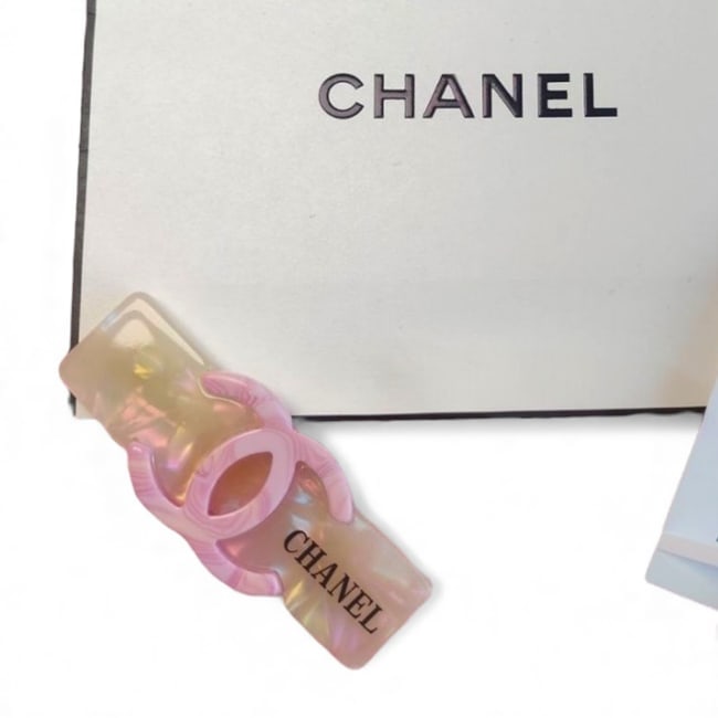 CHANEL Lg White Opal/Pink CC Wide Rectangle Beaute Hair Clip & Gift Bag: • CHANEL • Gabrielle • Hair Clip • White Opal • Pink Marble CC Logo • Black CHANEL Logo • Shape: Lg Wide Rectangle • L.A Collection • Original Gift Bag Inc