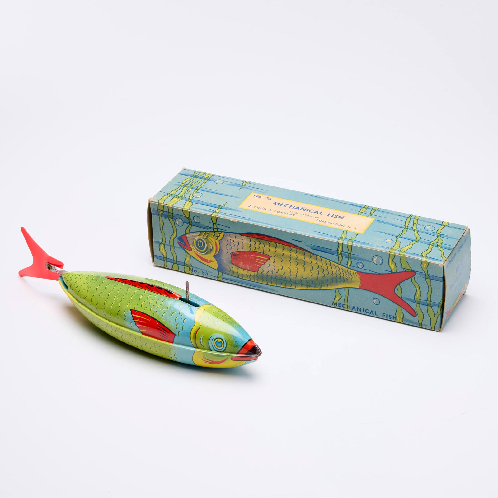 J. Chein & Company No. 55 Tin Mechanical Fish: J. Chein & Company No. 55 Tin Mechanical Fish USA, c. 1950 Condition Notes: Some light scratches scattered throughout. Wind-up mechanism is fully fuctional. Original box in good vintage condition with