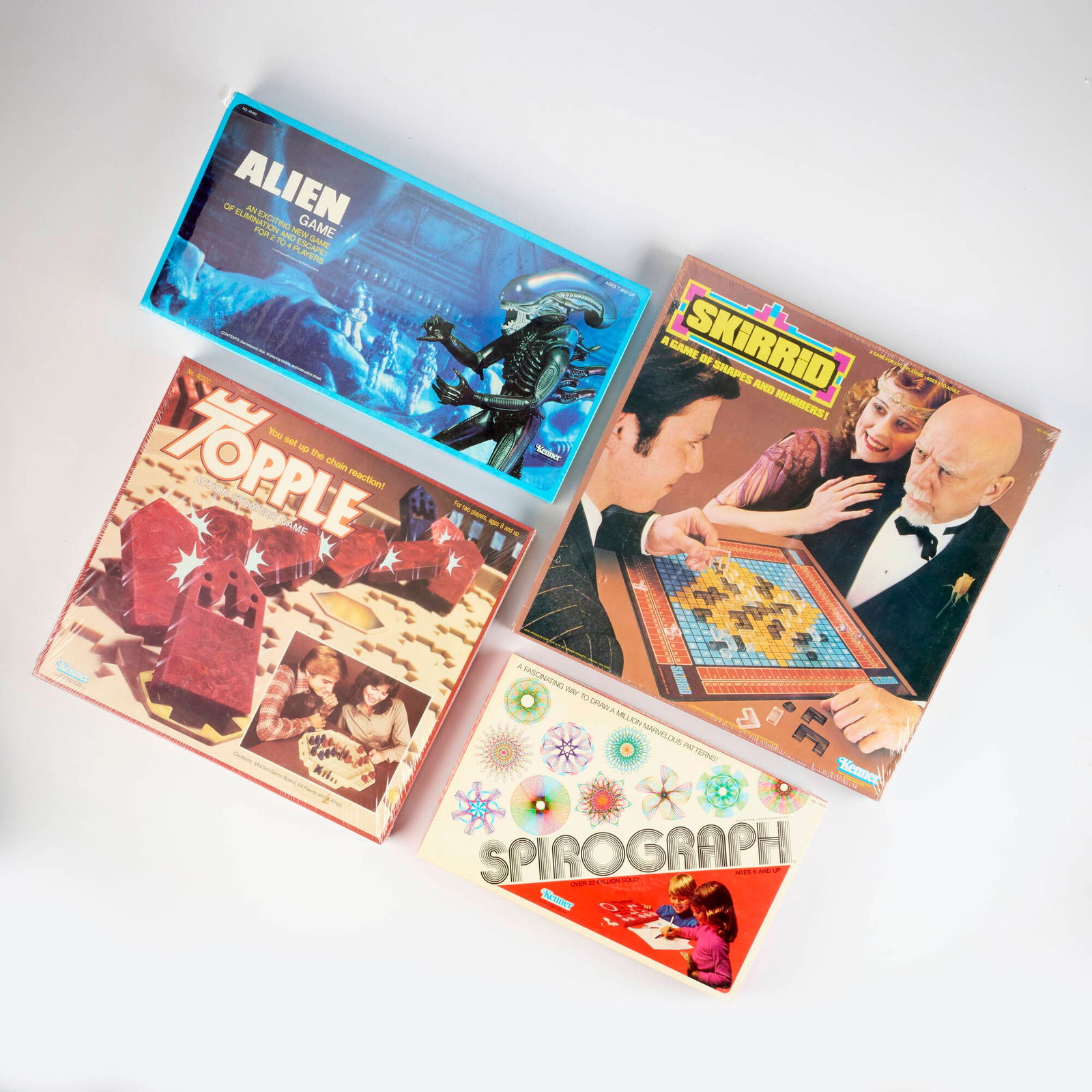 4PC 1973-1979 Kenner Board Game Group: 4PC 1973-1979 Kenner Board Game Group USA, 1973-1979 Group includes the following Kenner games: 1973 Spirograph (No, 14210) 1979 Alien Game (No. 40460) 1979 Skirrid (No. 40450) 1979 Topple (No. 40320)