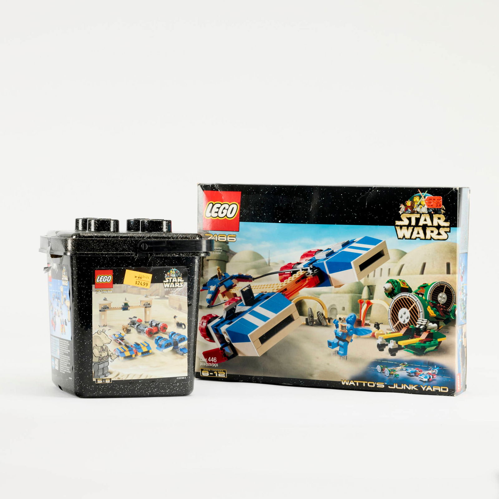 2PC 2000-01 LEGO Star Wars Podracer Bucket 7159 Watto's Junk Yard 7186 Group Sealed: 2PC 2000-01 LEGO Star Wars Podracer Bucket 7159 Watto's Junk Yard 7186 Group Sealed USA, 2000-01 15 h x 11 w x 2 d in (38 x 28 x 5 cm) 9 h x 7 w x 7 d in (23 x 18 x 18 cm) Group includes: 2000 Podrace