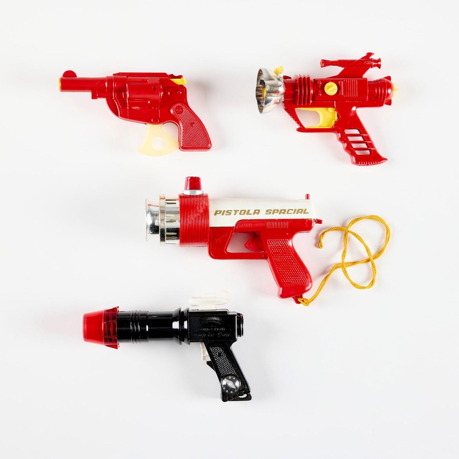 Four Vintage Plastic Ray Guns with Original Boxes: Four Vintage Plastic Ray Guns with Original Boxes molded plastic 5.75 h x 7.5 w x 2.25 d in (15 x 19 x 6 cm) 3.5 h x 6.75 w x 1.625 d in (9 x 17 x 4 cm) Includes Palitoy Dan Dare Cosmic Ray Gun, Lowbr