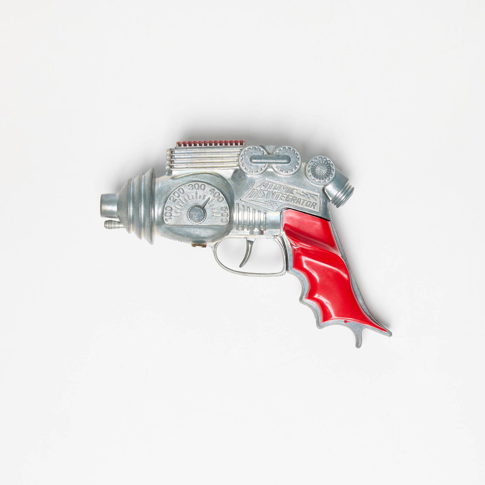 Hubley Atomic Disintegrator with Original Box: Hubley Atomic Disintegrator with Original Box zinc-plated cast steel, molded plastic 5 h x 7.25 w x 2.125 d in (13 x 18 x 5 cm) Sold with original packaging. Manufacturer's mark to gun and packaging '