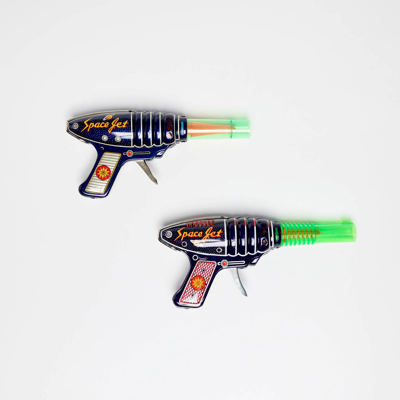 Two K.O Japan Tin Space Super Jet Gun with Original Box: Two K.O Japan Tin Space Super Jet Gun with Original Box transfer print, molded plastic, zinc-plated steel 4.25 h x 9.75 w x 1.75 d in (11 x 25 x 4 cm) 4.25 h x 9.125 w x 1.75 d in (11 x 23 x 4 cm) Sol