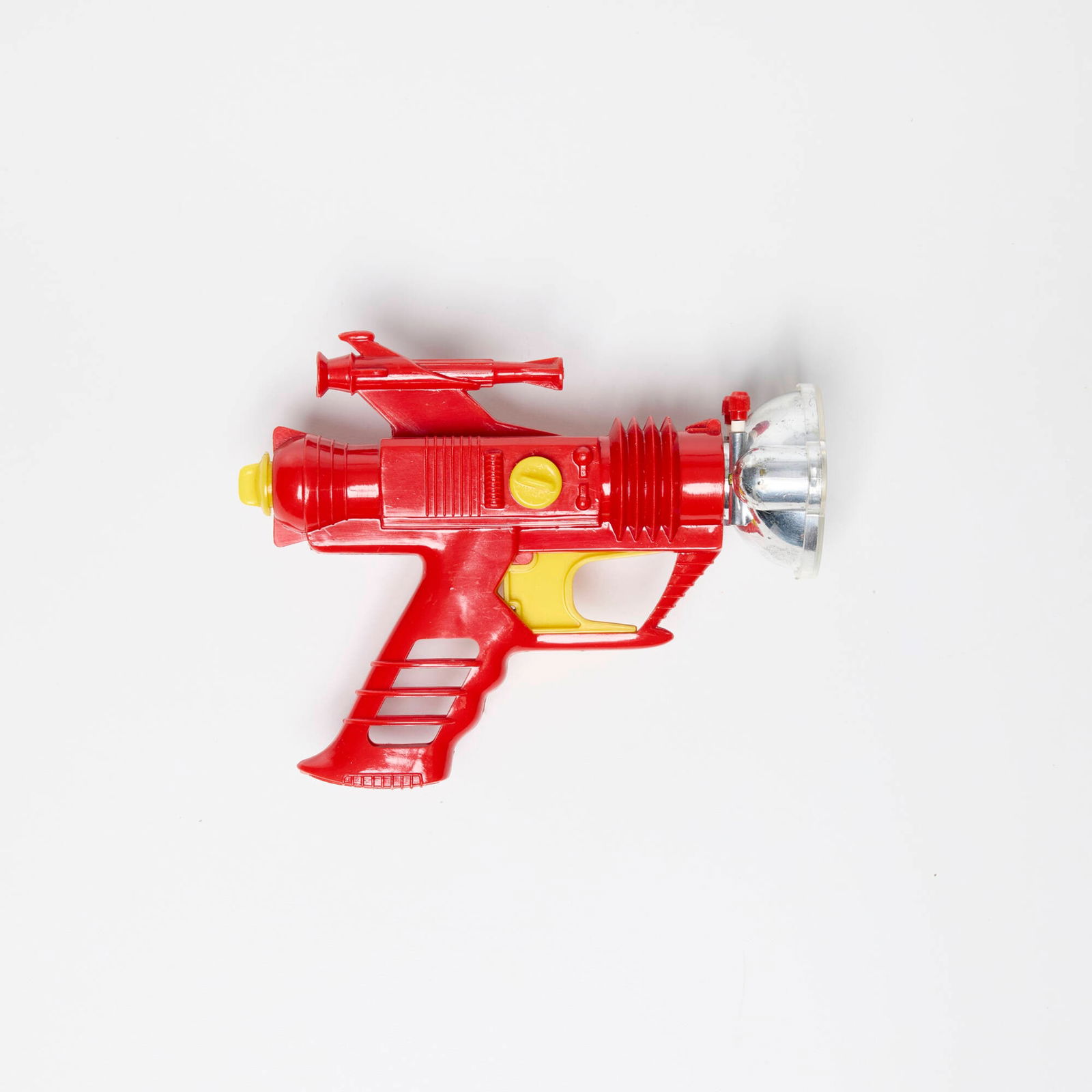 Palitoy Dan Dare Cosmic Ray Gun with Original Box: Palitoy Dan Dare Cosmic Ray Gun with Original Box molded plastic 5 h x 6.25 w x 2.5 d in (13 x 16 x 6 cm) Sold with original packaging. Printed manufacturer's mark to packaging 'Genuine Dan Dare Cosmi