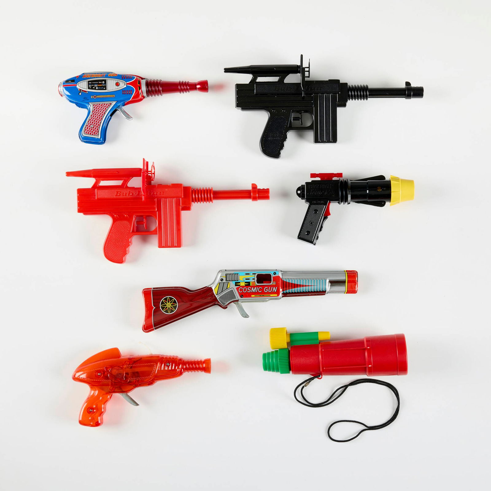 Seven Vintage Ray Guns with Original Box: Seven Vintage Ray Guns with Original Box molded plastic, transfer print on metal, zinc-plated steel largest: 5.75 h x 12.75 w x 2 d in (15 x 32 x 5 cm) smallest: 4.5 h x 7.25 w x 1.75 d in (11 x 18 x