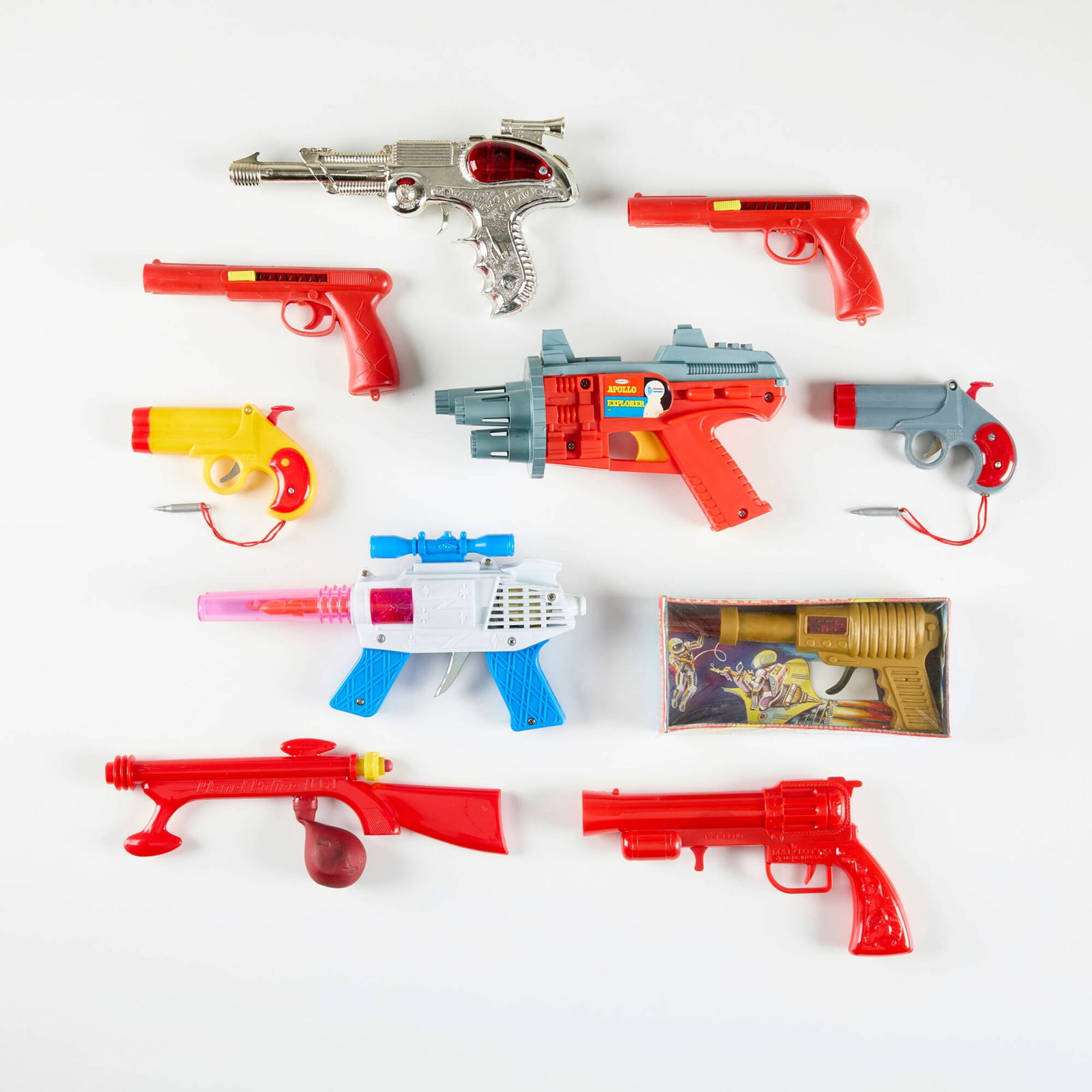 Ten Vintage Plastic Ray Guns with Original Box: Ten Vintage Plastic Ray Guns with Original Box plastic, metal largest: 5.5 h x 9.75 w x 3.5 d in (14 x 25 x 9 cm) smallest: 3.25 h x 5.25 w x 0.75 d in (8 x 13 x 2 cm) Condition Notes: Each example