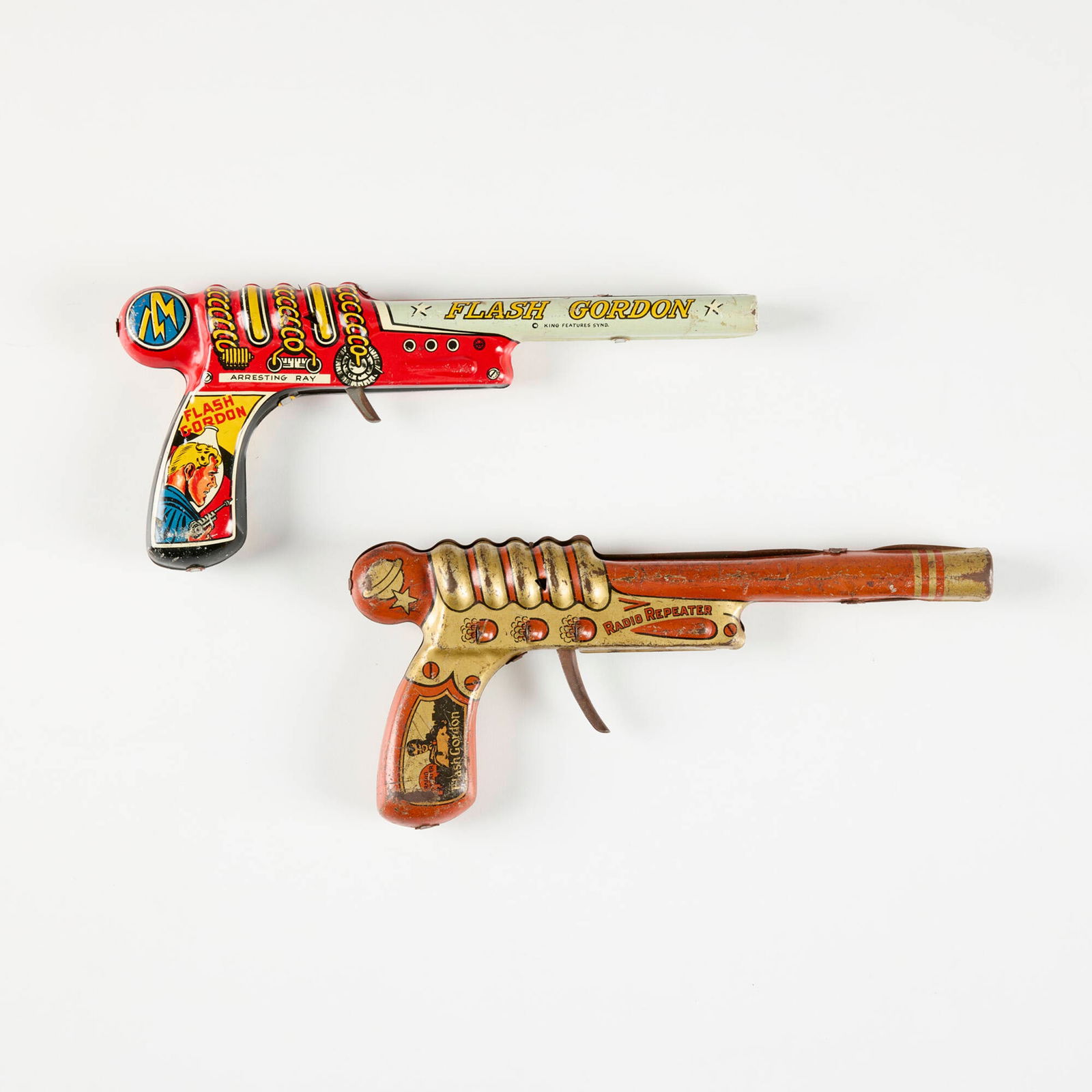 Two Marx Tin Flash Gordon Click Repeater Pistols (1 of 2)