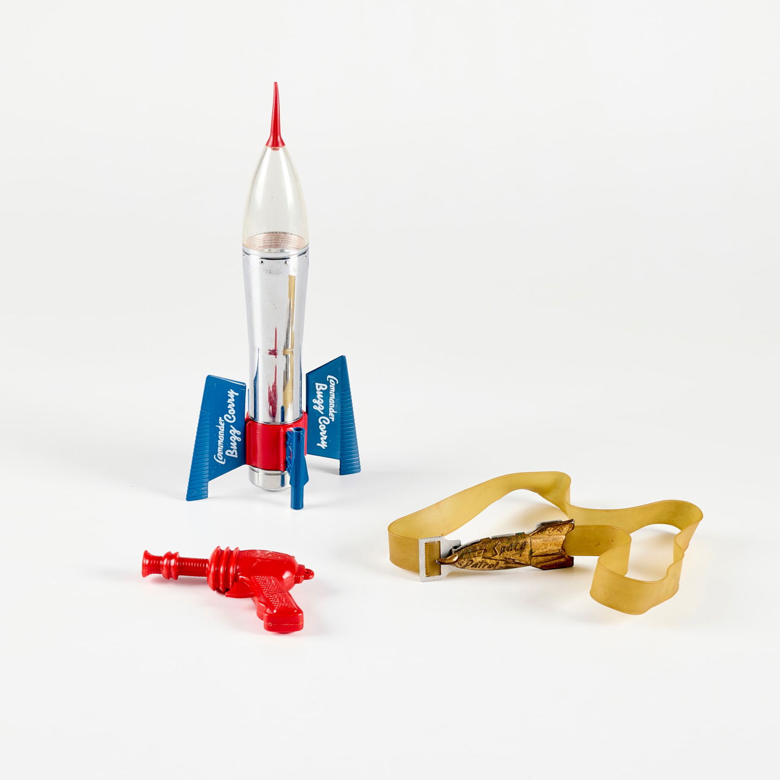 Space Novelty Flashlight and Toy Group: Space Novelty Flashlight and Toy Group plastic, chrome-plated steel, vinyl, rubber flashlight rocket: 12 h x 5.5 w x 3.375 d in (30 x 14 x 9 cm) belt: 1.25 h x 0.75 d x 30 l in (3 x 2 x 76 cm) water g