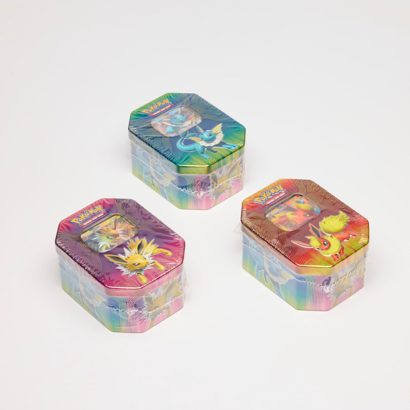 Three 2019 Pokemon Tins Factory Sealed Group: Three 2019 Pokemon Tins Factory Sealed Group USA, 2019 Factory Sealed Group includes: 2019 Pokemon Flareon GX Tin, 2019 Pokemon Jolteon GX Tin, 2019 Pokemon Vaporeon GX Tin. Condition Notes:
