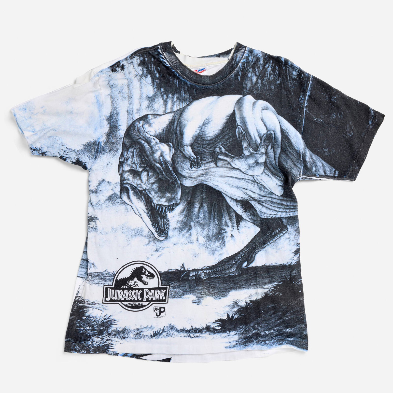 Jurassic Park Movie All Over Print X-Large T-Shirt Single Stitch: Jurassic Park Movie All Over Print X-Large T-Shirt Single Stitch 1993 100% cotton, single stitch 21 w x 27 l in (53 x 69 cm) Condition Notes: Overall good vintage condition with minimal wear consi
