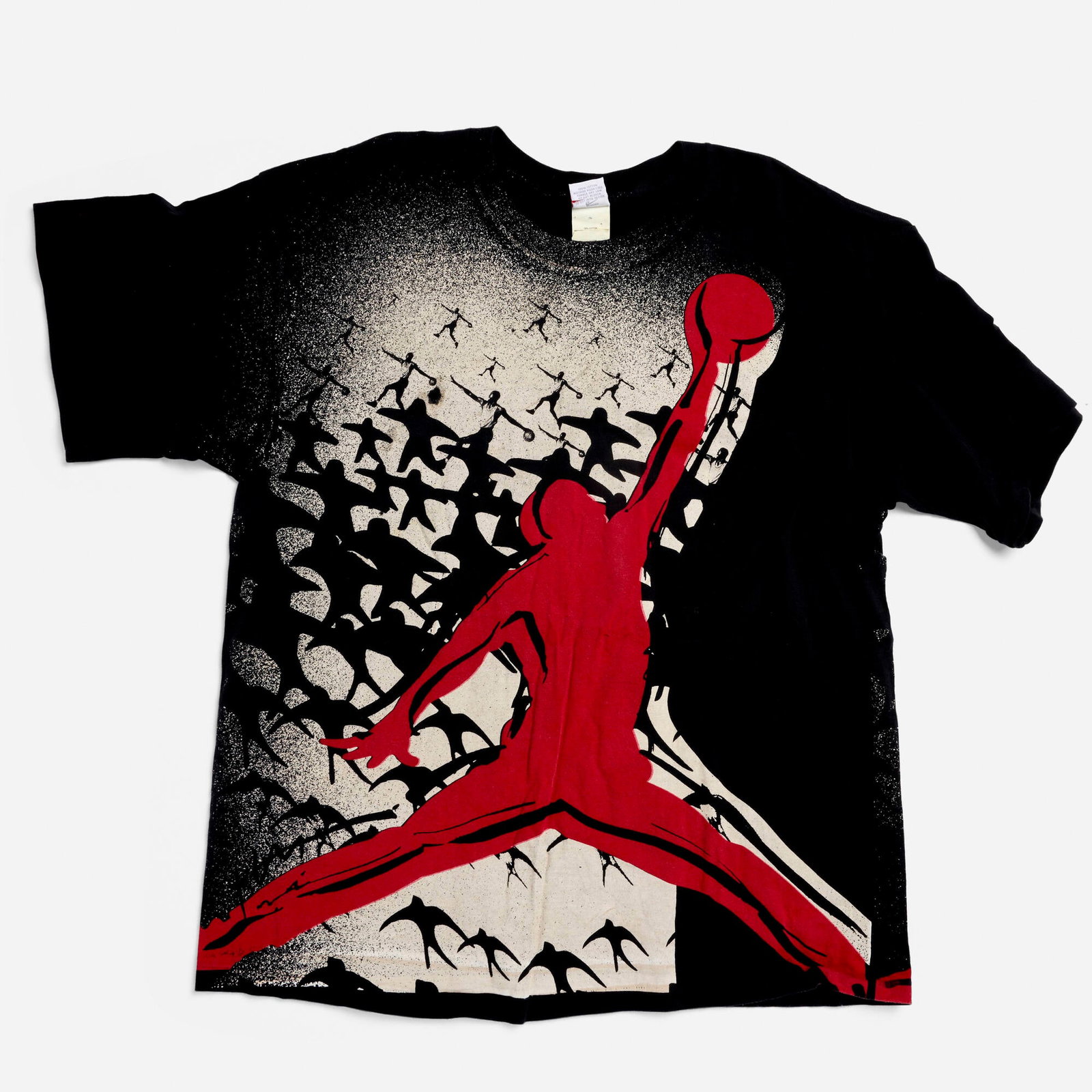 Vintage Nike Flying Air Jordan All Over Print X-Large T-Shirt: Vintage Nike Flying Air Jordan All Over Print X-Large T-Shirt 100% cotton, double stitch 22.5 w x 27 l in (57 x 69 cm) Condition Notes: 1 cm horizontal cut to tag. Front of shirt has two 1.5 cm x 1 cm