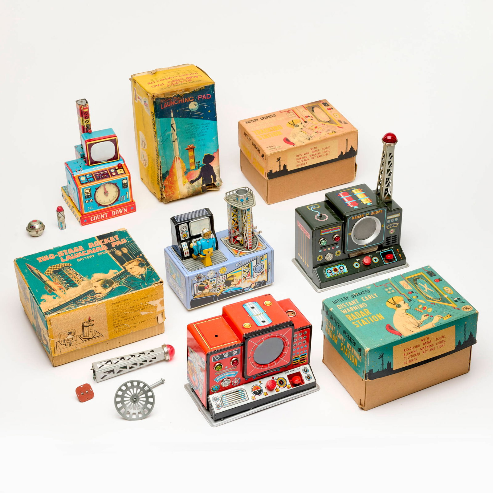 4PC Japanese Tin Space Rocket Launch Boxed Toy Group: 4PC Japanese Tin Space Rocket Launch Boxed Toy Group 5.75 h x 8.25 w x 5 d in (15 x 21 x 13 cm) 8 h x 8 w x 4.5 d in (20 x 20 x 11 cm) Group includes: Modern Toys Battery Operated Distant Early Warnin