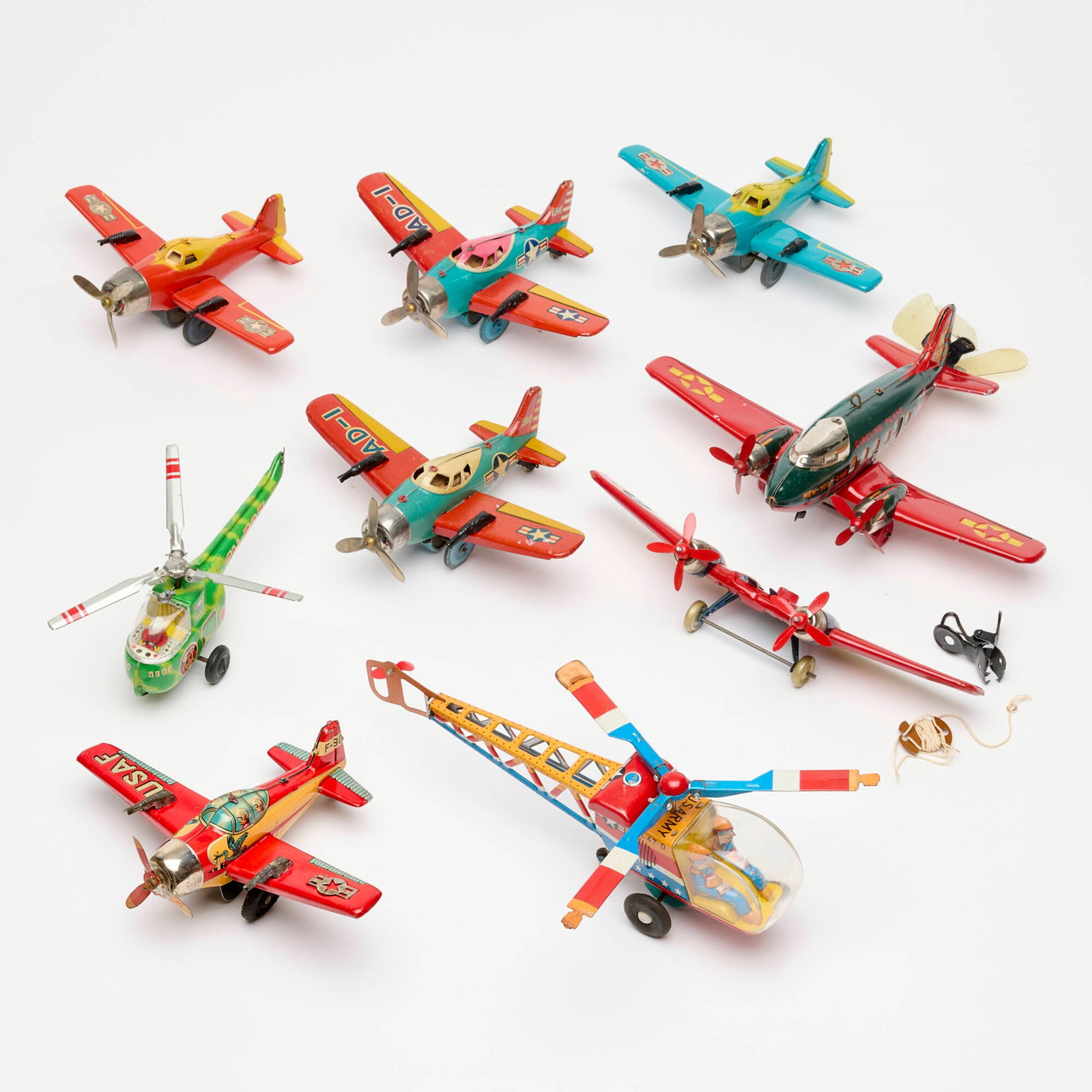 9PC Japanese Tin Friction and Wind-Up Plane Helicopter Toy Group: 9PC Japanese Tin Friction and Wind-Up Plane Helicopter Toy Group Japan 3 h x 6.5 w x 2 d in (8 x 17 x 5 cm) 3.5 h x 10 w x 2 d in (9 x 25 x 5 cm) Group includes: ATC Friction Military Helicopter Circl