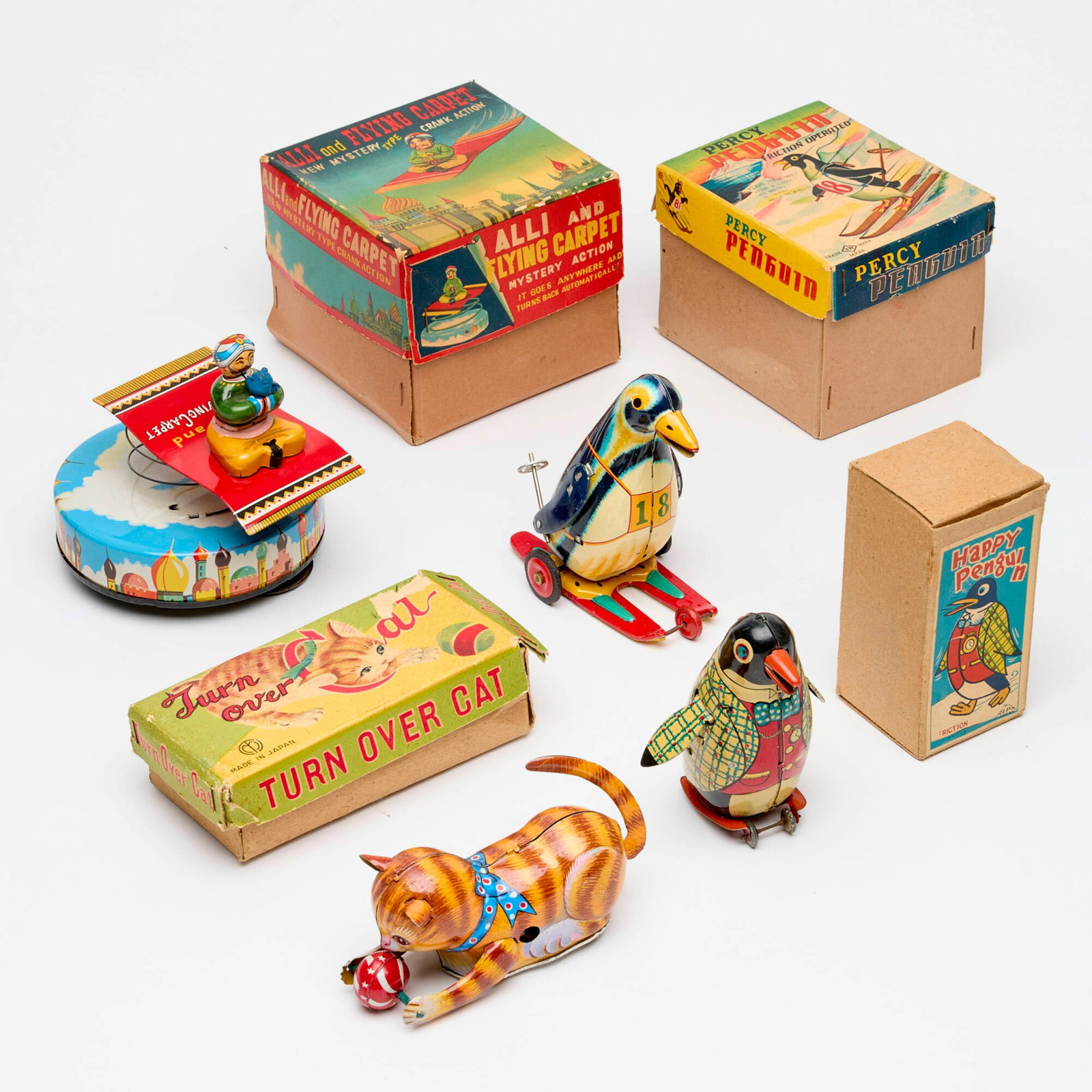 4PC Japanese Tin Lithograph Boxed Toy Group: 4PC Japanese Tin Lithograph Boxed Toy Group Japan 4.75 h x 4.75 w x 4 d in (12 x 12 x 10 cm) 4.5 h x 2.25 w x 2.25 d in (11 x 6 x 6 cm) Group includes: Alps Friction Happy Penguin Nomura Toys (T.N.) P