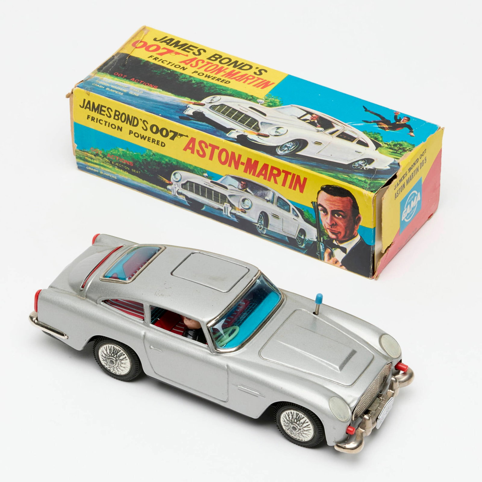 Gama James Bond's 007 Aston Martin DB5 Tin Friction Car Boxed: Gama James Bond's 007 Aston Martin DB5 Tin Friction Car Boxed 3.25 h x 8 w x 2.5 d in (8 x 20 x 6 cm) Car actions workingCondition Notes: Minimal wear to tin from moving in box over time. Box with wea