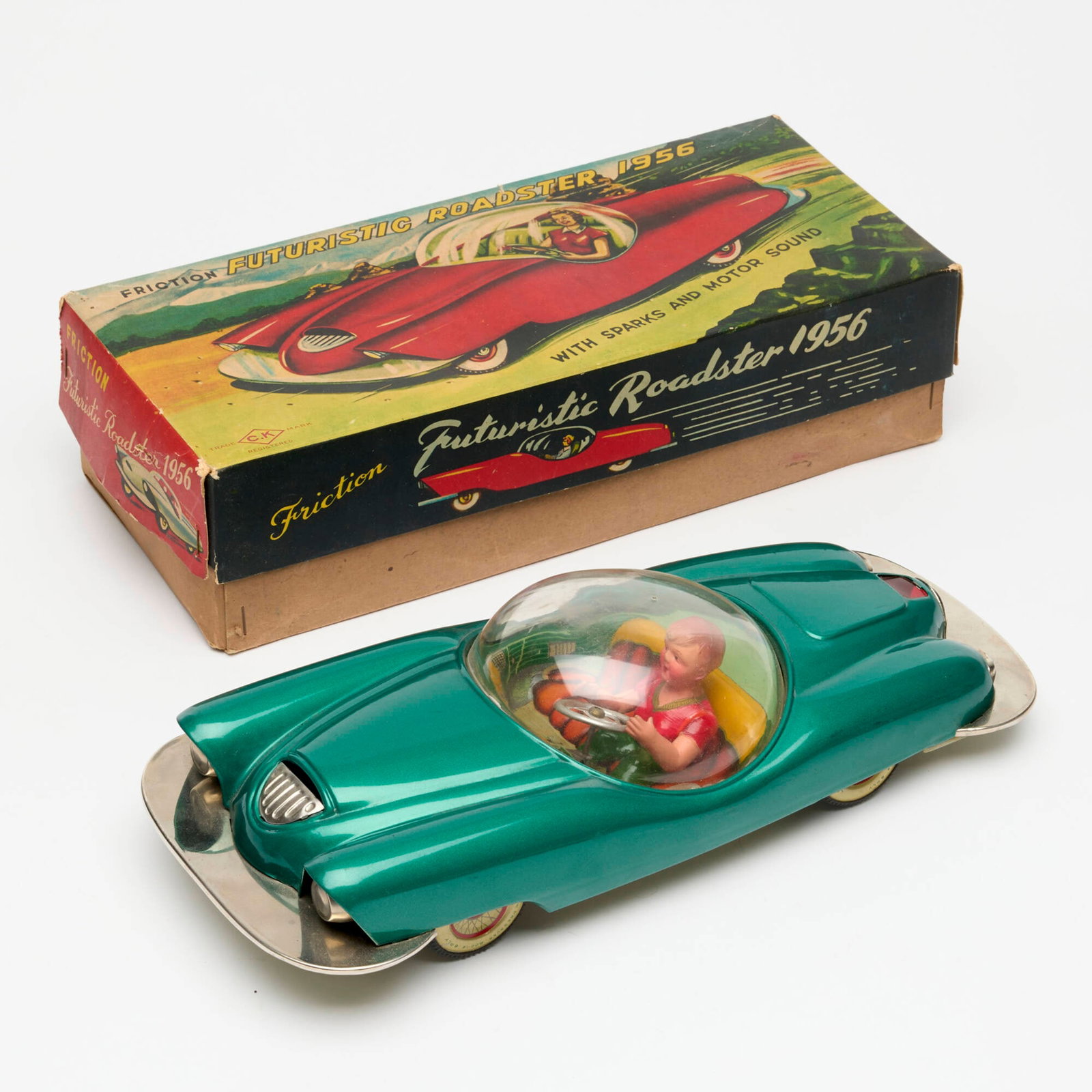 C.K. Kuramochi Co. Tin Friction Futuristic Roadster Boxed: C.K. Kuramochi Co. Tin Friction Futuristic Roadster Boxed Japan c. 1956 5.25 h x 12.25 w x 3.25 d in (13 x 31 x 8 cm) Condition Notes: Complete in box. Near unused condition with minimal wear to dieca