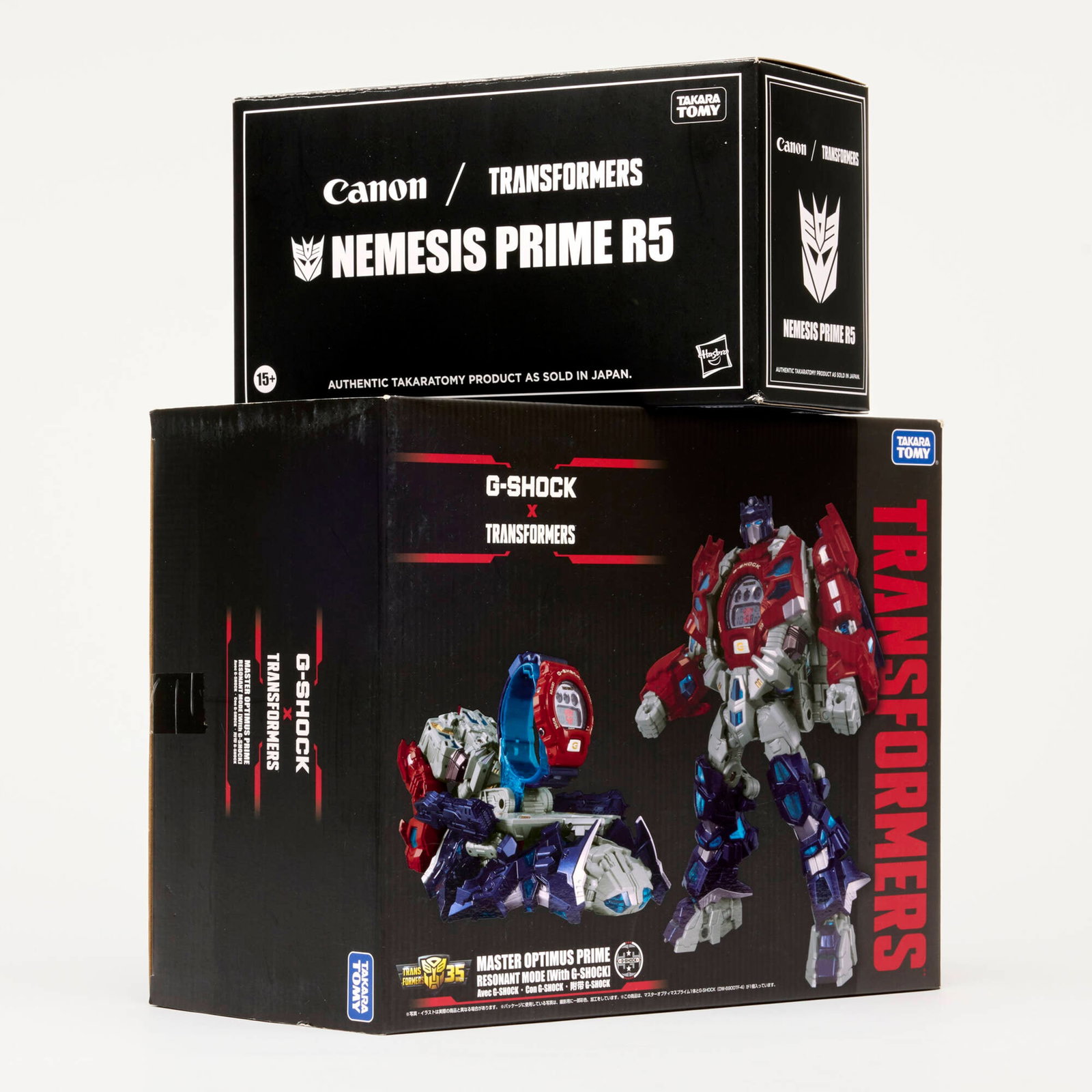 Hasbro TakaraTomy G-Shock Master Optimus Prime DW-6900TF-SET Canon/Transformers Nemesis Prime R5: 2PC 2018 and 2024 Hasbro and TakaraTomy G-Shock x Transformers Master Optimus Prime DW-6900TF-SET and Canon/Transformers Nemesis Prime R5 Group Factory Unused USA, 2018, 2024 9.25 h x 11.75 w x 6 d in