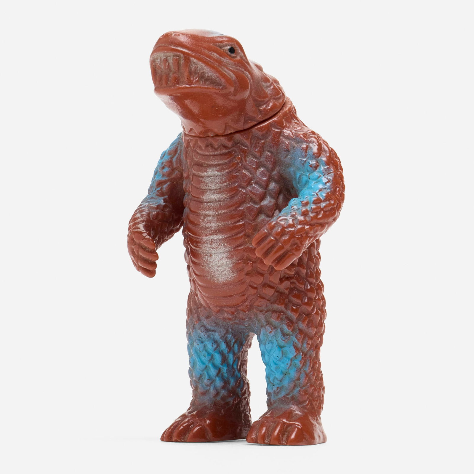 Orange Return of Ultraman Mognez Mini Vinyl: Orange Return of Ultraman Mognez Mini Vinyl Orange Japan, c. 1970 3.5 h x 2 w x 2 d in (9 x 5 x 5 cm) Condition notes: Overall very good condition with minimal scattered paint rubs. This work will shi