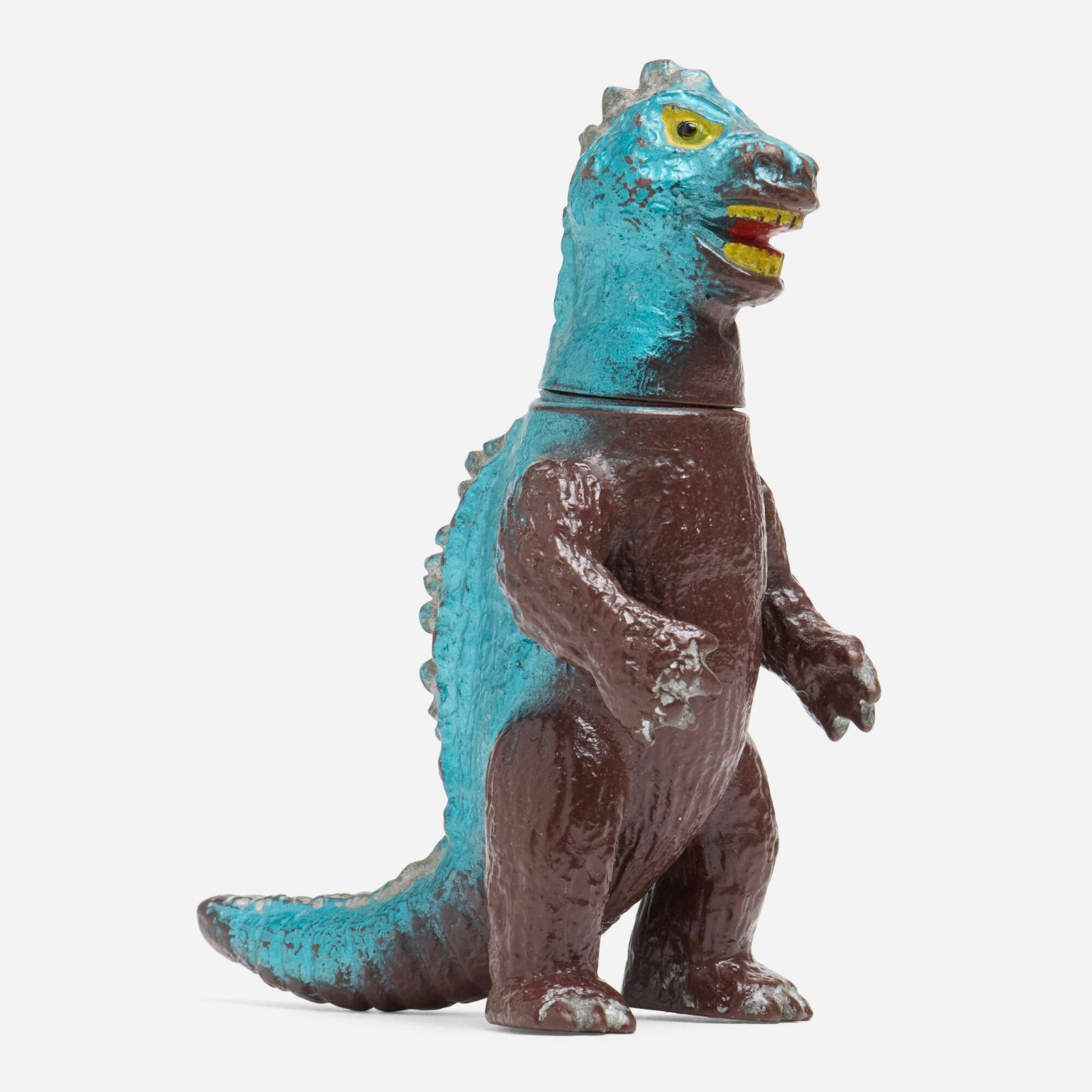 Bullmark Toho Godzilla Mini Vinyl: Bullmark Toho Godzilla Mini Vinyl Bullmark Japan, c. 1970 4.25 h x 1.75 w x 3.25 d in (11 x 4 x 8 cm) Condition notes: Overall very good condition with moderate scattered paint rubs This work will shi