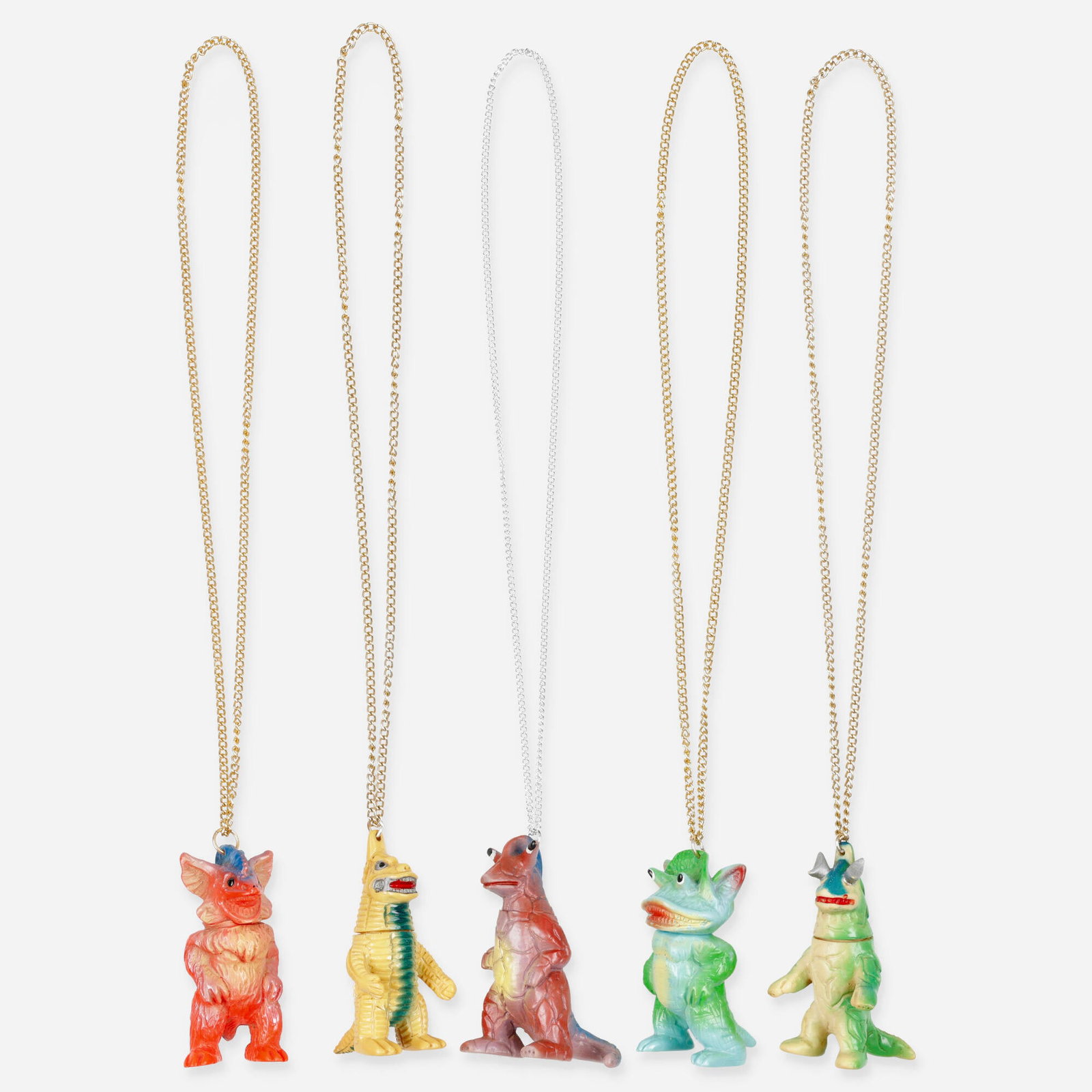 Ultraman and Paichi Kaiju Mini Vinyl Necklace Group: Ultraman and Paichi Kaiju Mini Vinyl Necklace Group Japan, c. 1970 3 h x 1.75 w x 1.75 d x 15 l in (8 x 4 x 4 x 38 cm) Group includes a Red King, Eleking, and three Paichi design mini vinyl pendant ne