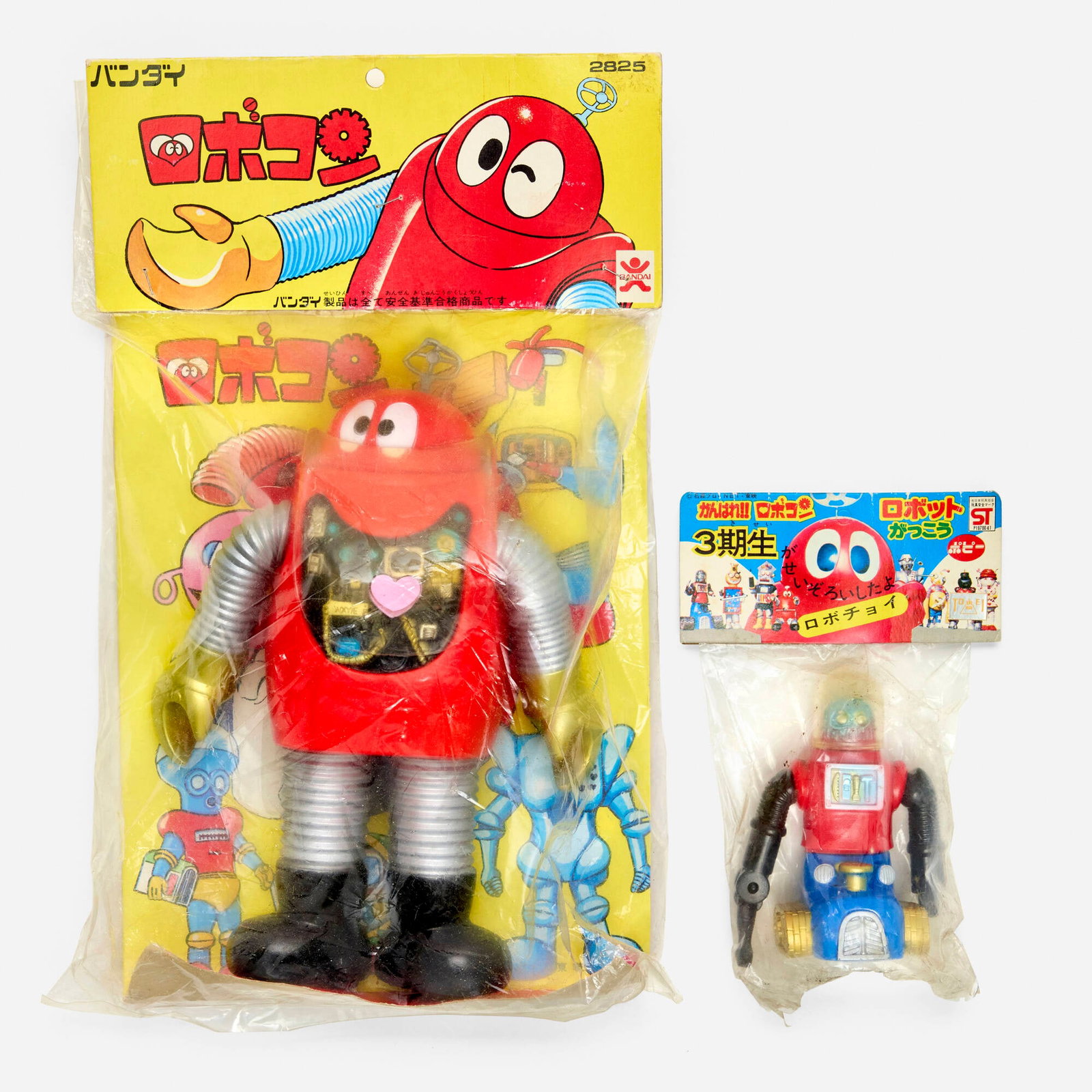 Bandai and Popy Ganbare!! Robocon Bagged Vinyl Group: Bandai and Popy Ganbare!! Robocon Bagged Vinyl Group Bandai Japan, c. 1970 12.5 h x 7.5 w x 2.25 d in (32 x 19 x 6 cm) 6 h x 4.5 w x 1.5 d in (15 x 11 x 4 cm) Condition notes: Both factory sealed in