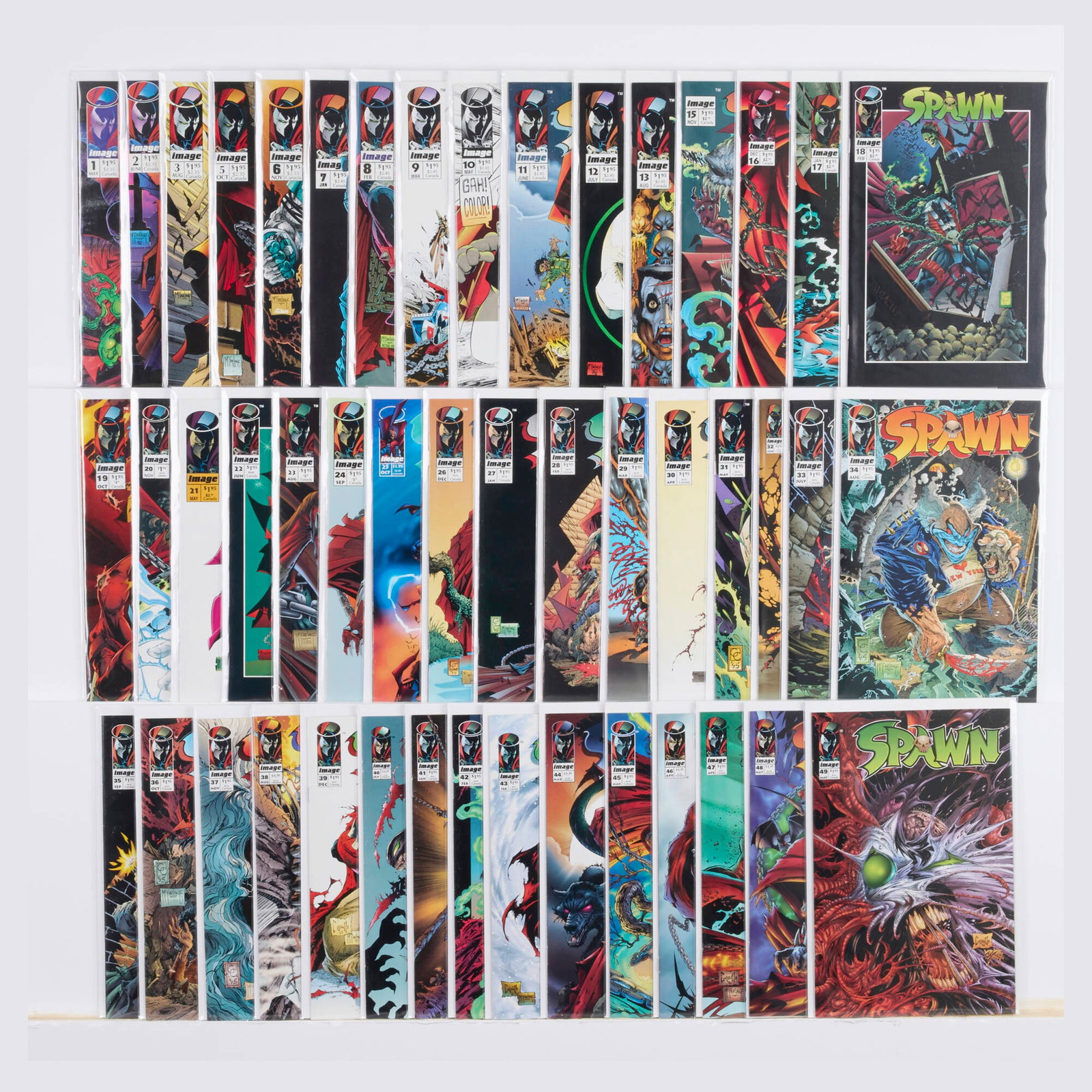 47 Image Comics Spawn #1-#49 Group: 47 Image Comics Spawn #1-#49 Group USA, 20th Century Group includes: Image Comics Spawn #1-#3, #5-#13, #15-#49 (Grades range 7.0-8.0). This work will ship from Millville, Massachusetts.