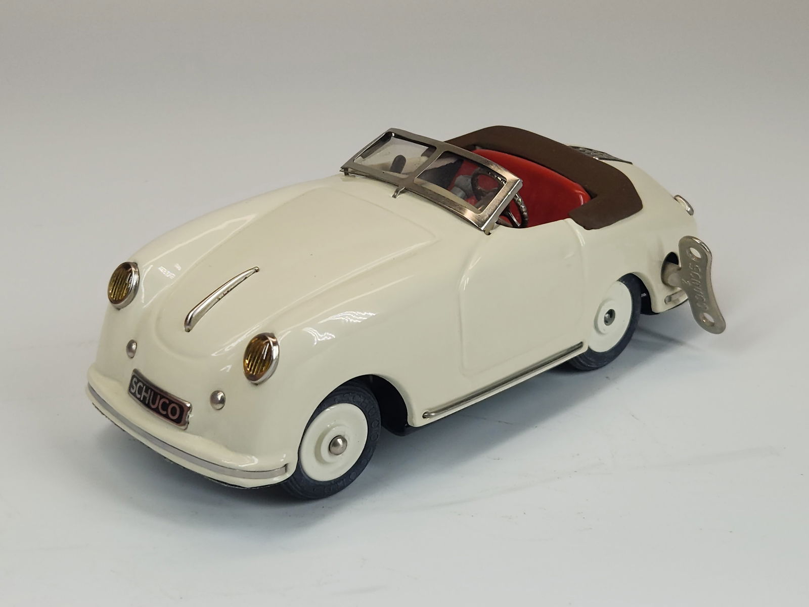 SCHUCO SPORT EXAMICO PORSCHE WIND UP W/ KEY: REMAINS IN GOOD CONDITION, SHOWING SOME TYPICAL USAGE WEAR.