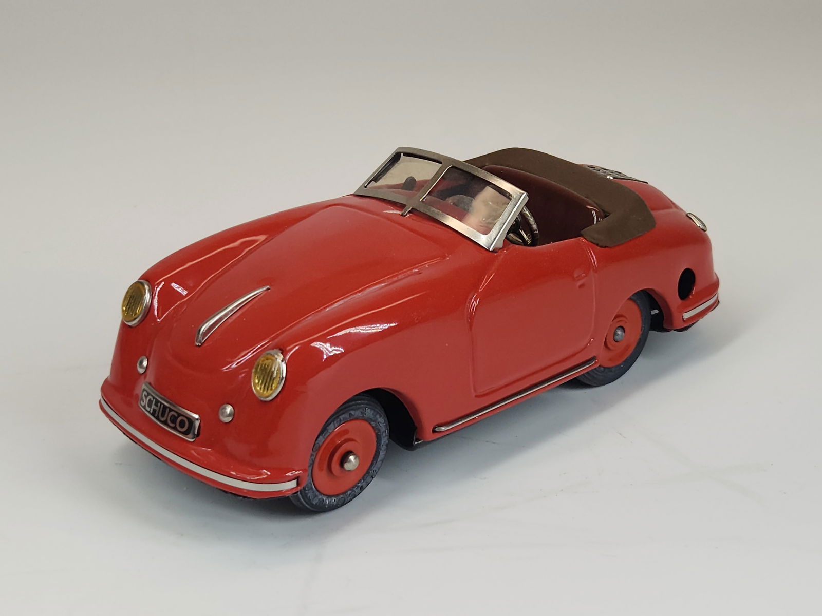 SCHUCO SPORT EXAMICO PORSCHE WIND UP W/ KEY: REMAINS IN GOOD CONDITION, SHOWING SOME TYPICAL USAGE WEAR.