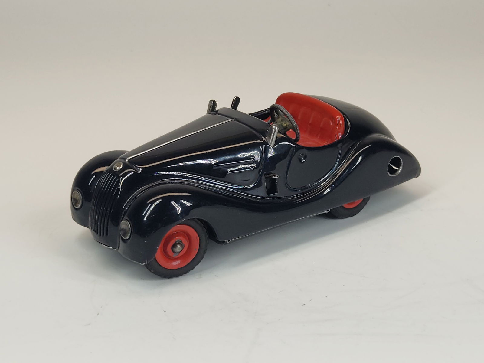 VINTAGE SCHUCO EXAMICO 4001 WIND UP CAR: REMAINS IN GOOD CONDITION, SHOWING SOME TYPICAL USAGE WEAR.