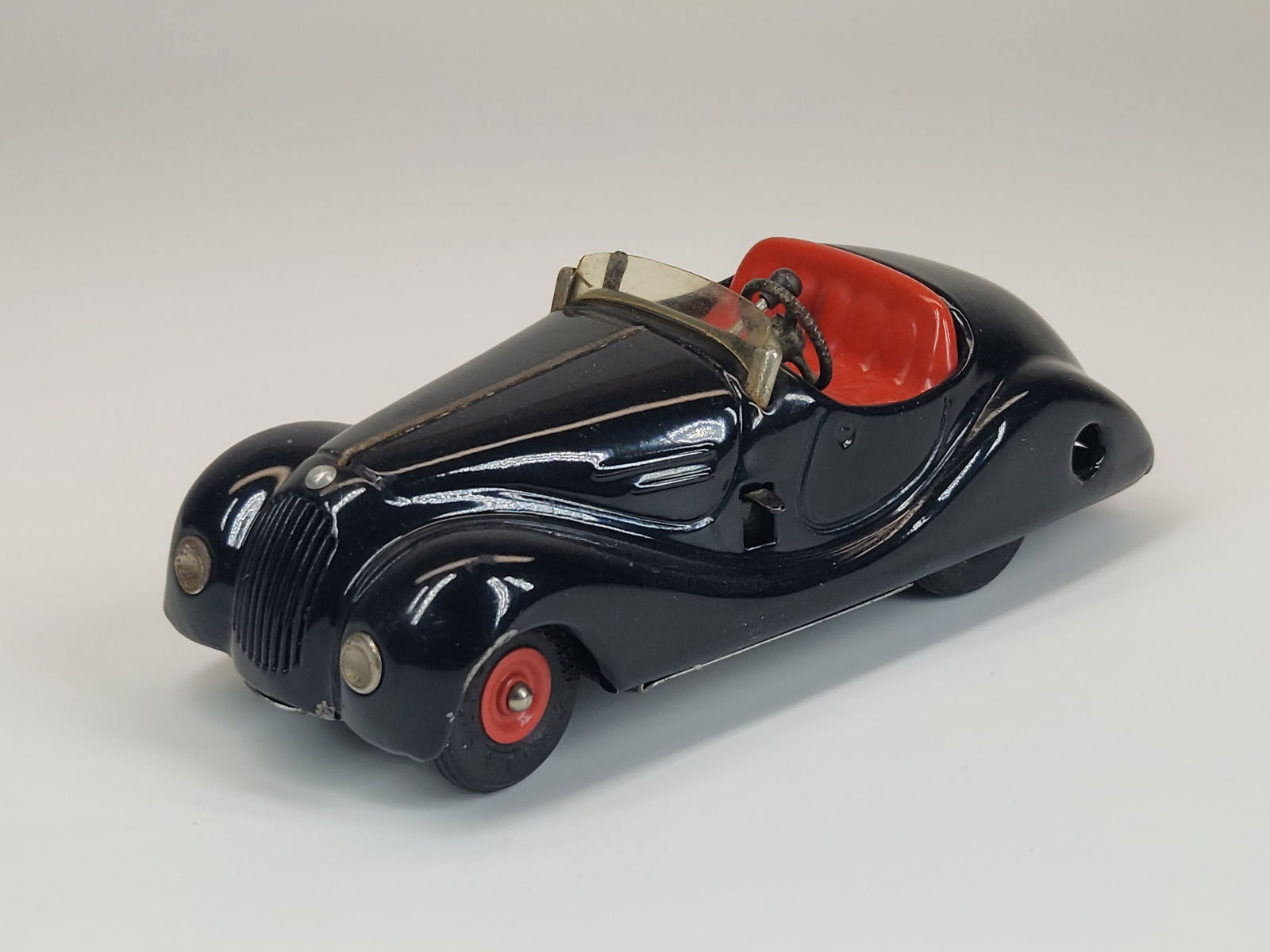 VINTAGE SCHUCO EXAMICO 4001 WIND UP CAR: REMAINS IN GOOD CONDITION, SHOWING SOME TYPICAL USAGE WEAR.