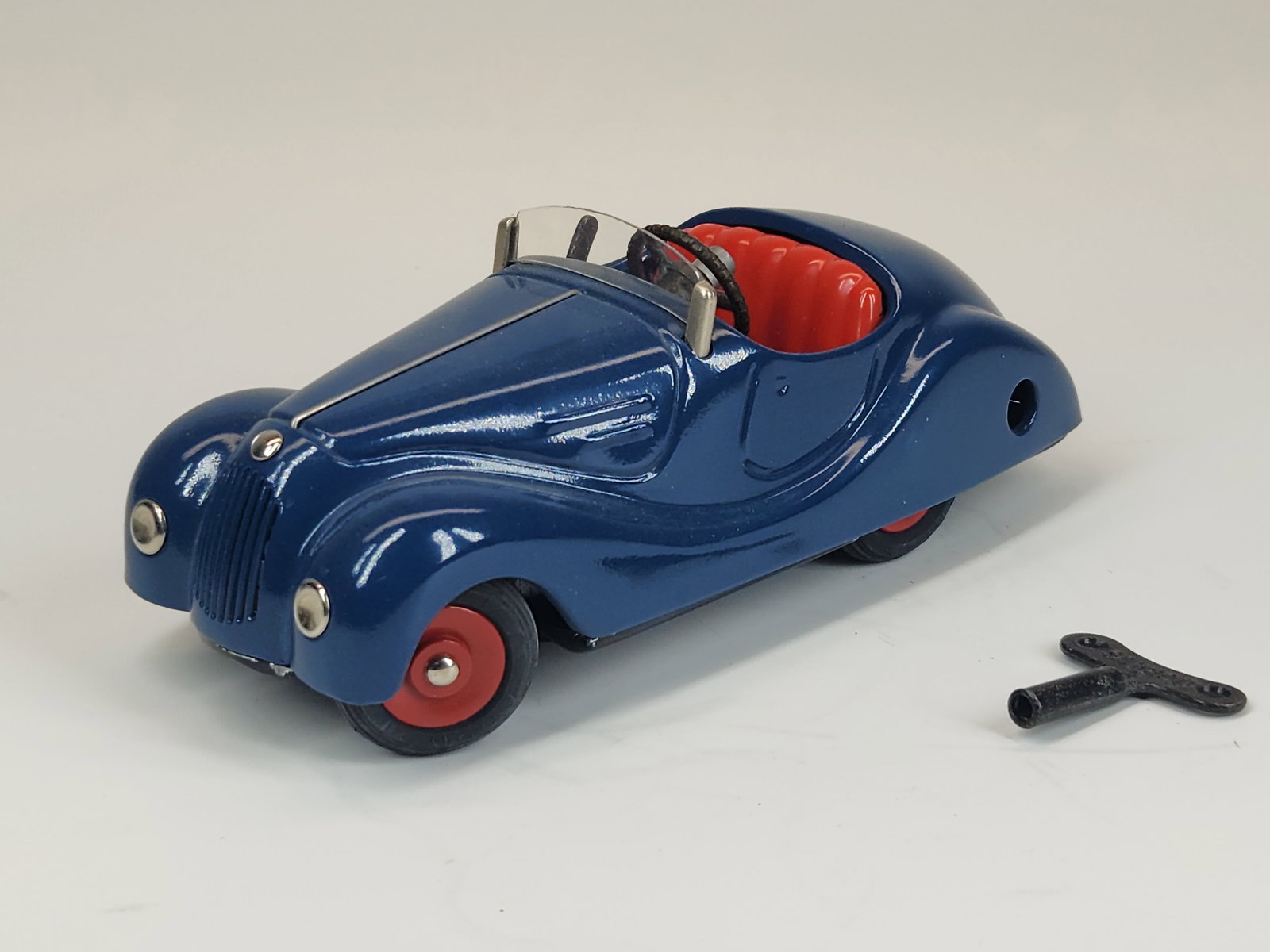 SCHUCO AKUSTICO 2002 WIND UP CAR: REMAINS IN GOOD CONDITION, SHOWING SOME TYPICAL USAGE WEAR.