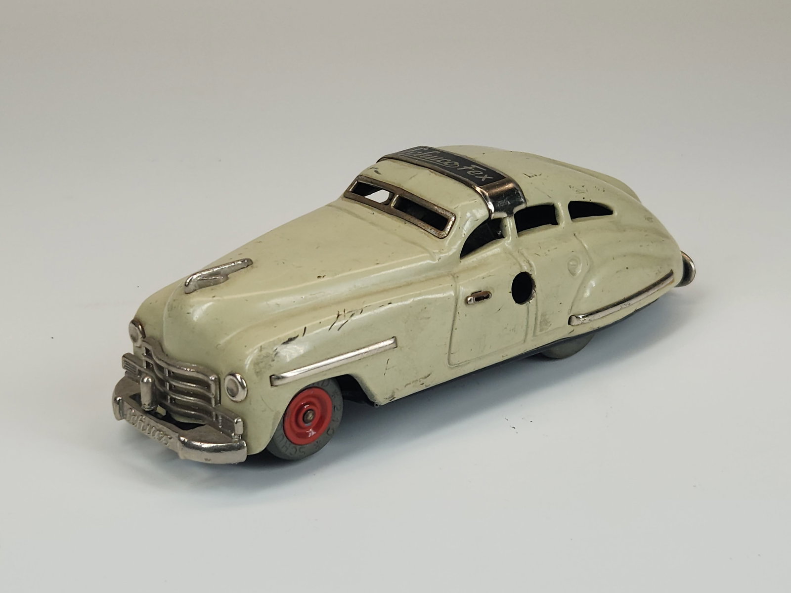 VINTAGE SCHUCO FEX 1111 WIND UP CAR: REMAINS IN GOOD CONDITION, SHOWING SOME TYPICAL USAGE WEAR.