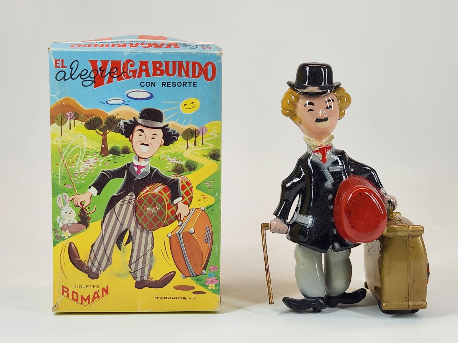 VINTAGE PLASTIC WIND UP CHARLIE CHAPLIN W/ BOX: REMAINS IN VERY GOOD CLEAN CONDITION. BOX REMAINS NICE. WIND UP MECHANISM WORKS AS SHOULD.