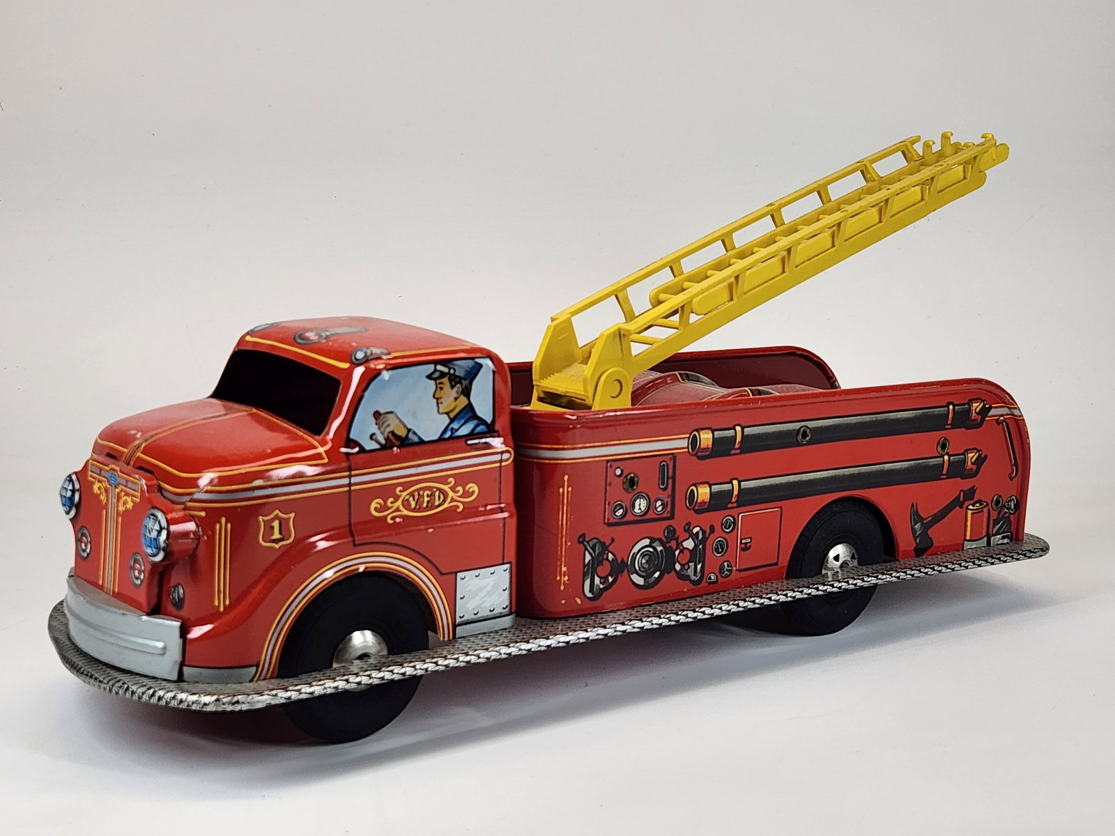 VINTAGE MARX PRESSED STEEL FIRE TRUCK: REMAINS IN VERY GOOD CLEAN CONDITION, SHOWING ONLY SOME MINIMAL WEAR.