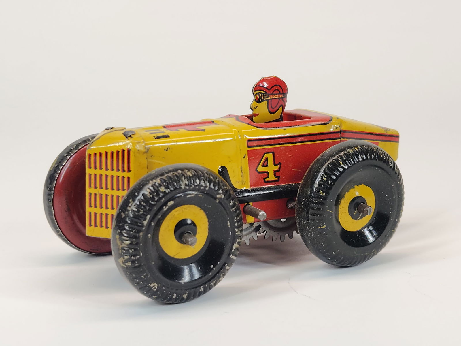 MARX TIN LITHO WIND UP RACE CAR NO. 4: REMAINS IN GOOD CONDITION, SHOWING SOME TYPICAL WEAR.
