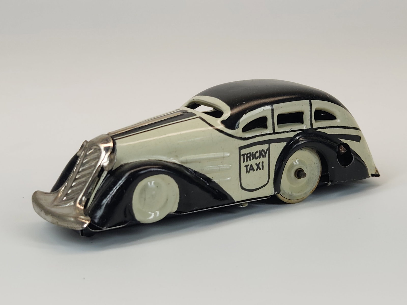 MARX WIND UP TRICKY TAXI CAB: REMAINS IN GOOD CONDITION.