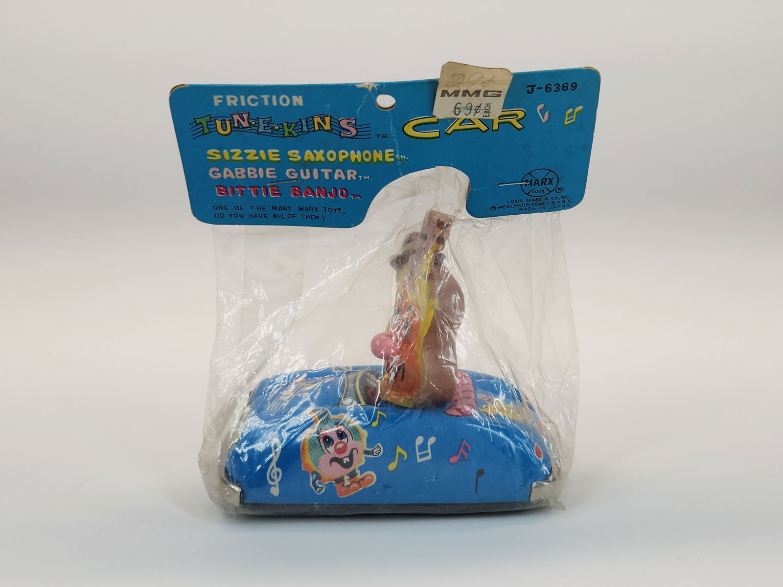 MARX TIN FRICTION TUNE-KINS SAXOPHONE CAR NIP: REMAINS NEW IN PACKAGE.