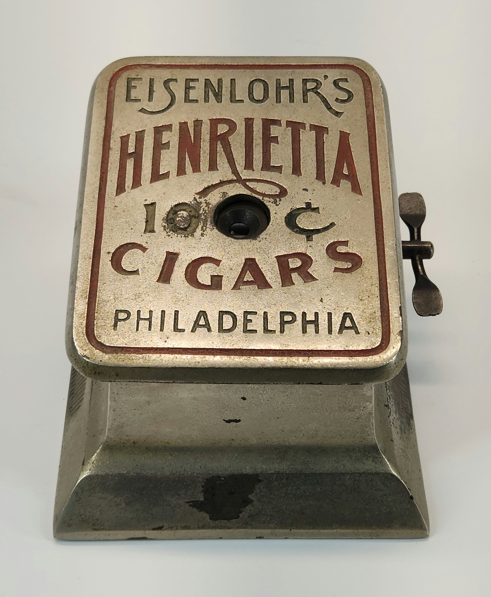 EL SENLOHR'S HENRIETTA TABLETOP CIGAR CUTTER: REMAINS IN GOOD CONDITION, SHOWING SOME TYPICAL WEAR. WIND UP MECHANISM IS LOCKED. MATCH STRIKE ON SIDE.