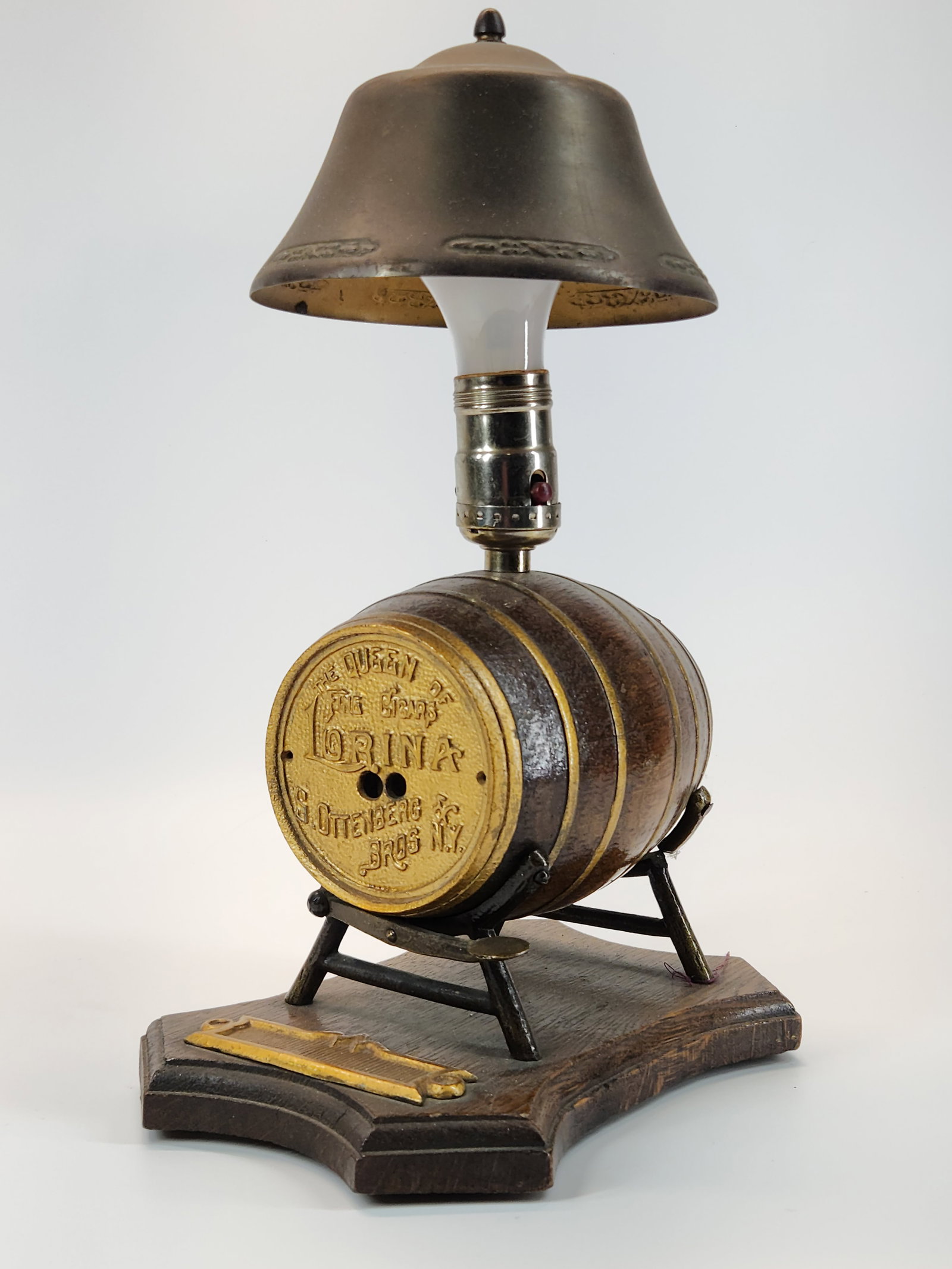 LORINA NY. QUEEN OF CIGARS BARREL LAMP W/ STRIKER: REMAINS IN GOOD CONDITION, SHOWING SOME TYPICAL WEAR. CUTTER WORKS, HOWEVER NEEDS TO BE MANUAL ADJUSTED. MEASURES APPROXIMATELY 14" TALL.