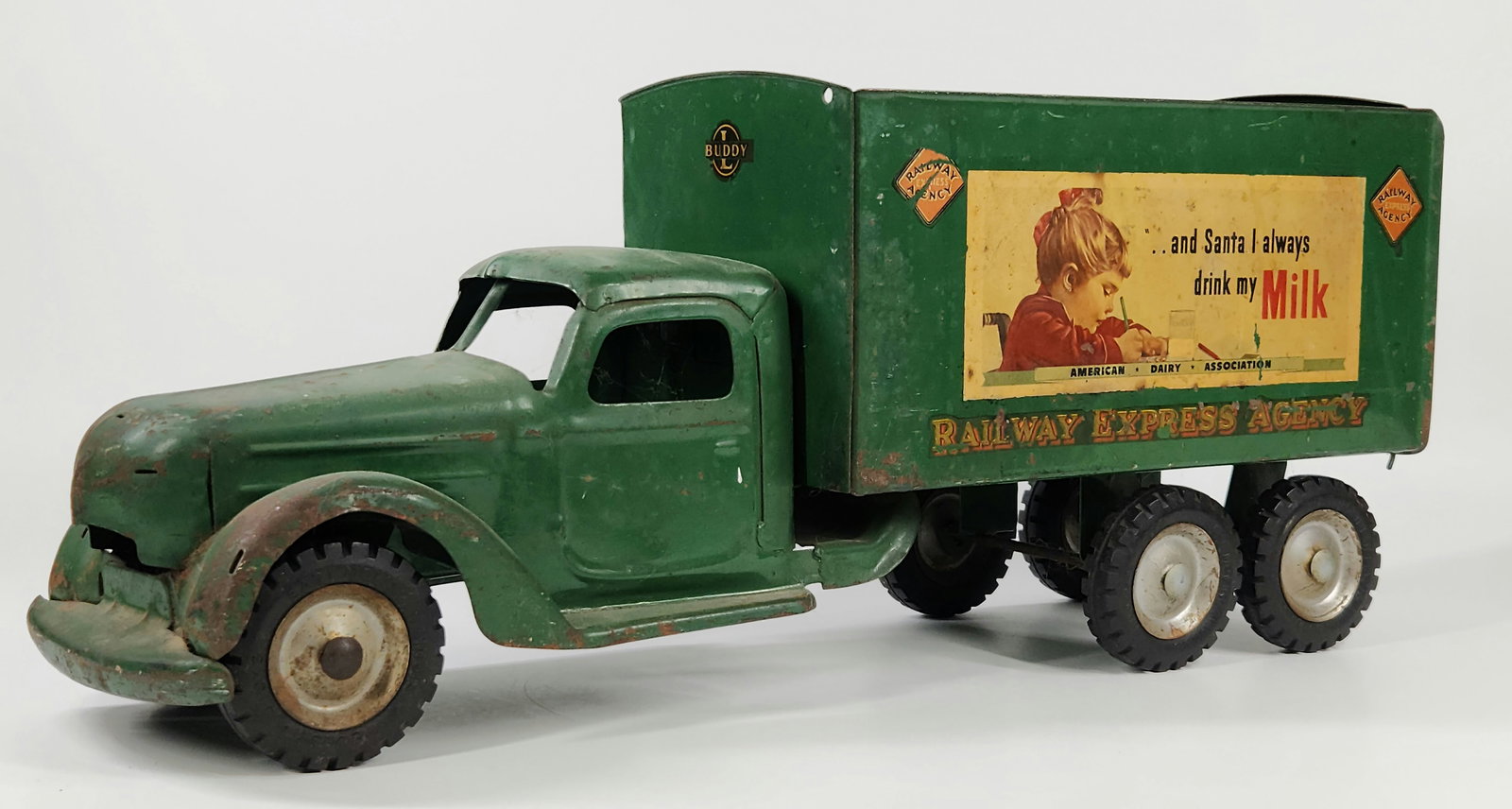 BUDDY L PRESSED STEEL RAILWAY AGENCY TRUCK: REMAINS IN FAIR TO GOOD CONDITION. MISSING TOP AND FRONT GRILL PIECE. MEASURES APPROXIMATELY 22" LONG.
