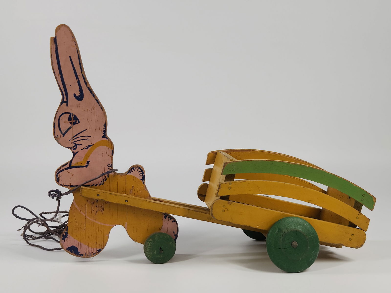 WOOD EASTER BUNNY RABBIT PULL TOY CONTAINER: REMAINS IN GOOD CONDITION, SHOWING USAGE WEAR. MEASURES APPROXIMATELY 14" LONG.