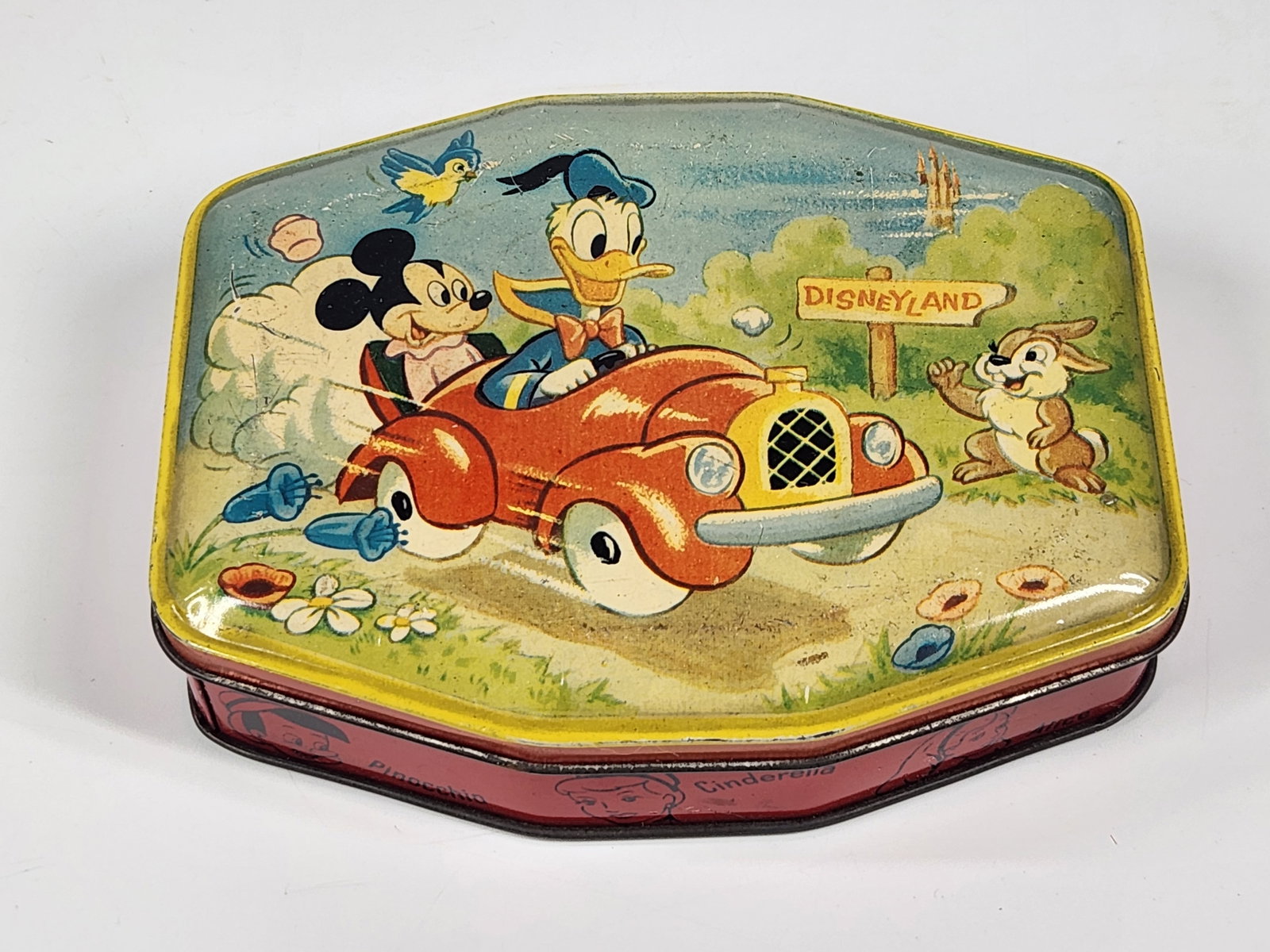 GEORGE W. HORNER DISNEYLAND CANDY TIN: TIN REMAINS IN VERY GOOD CONDITION, SHOWING SOME TYPICAL WEAR. MEASURES APPROXIMATELY 5.5" ACROSS.