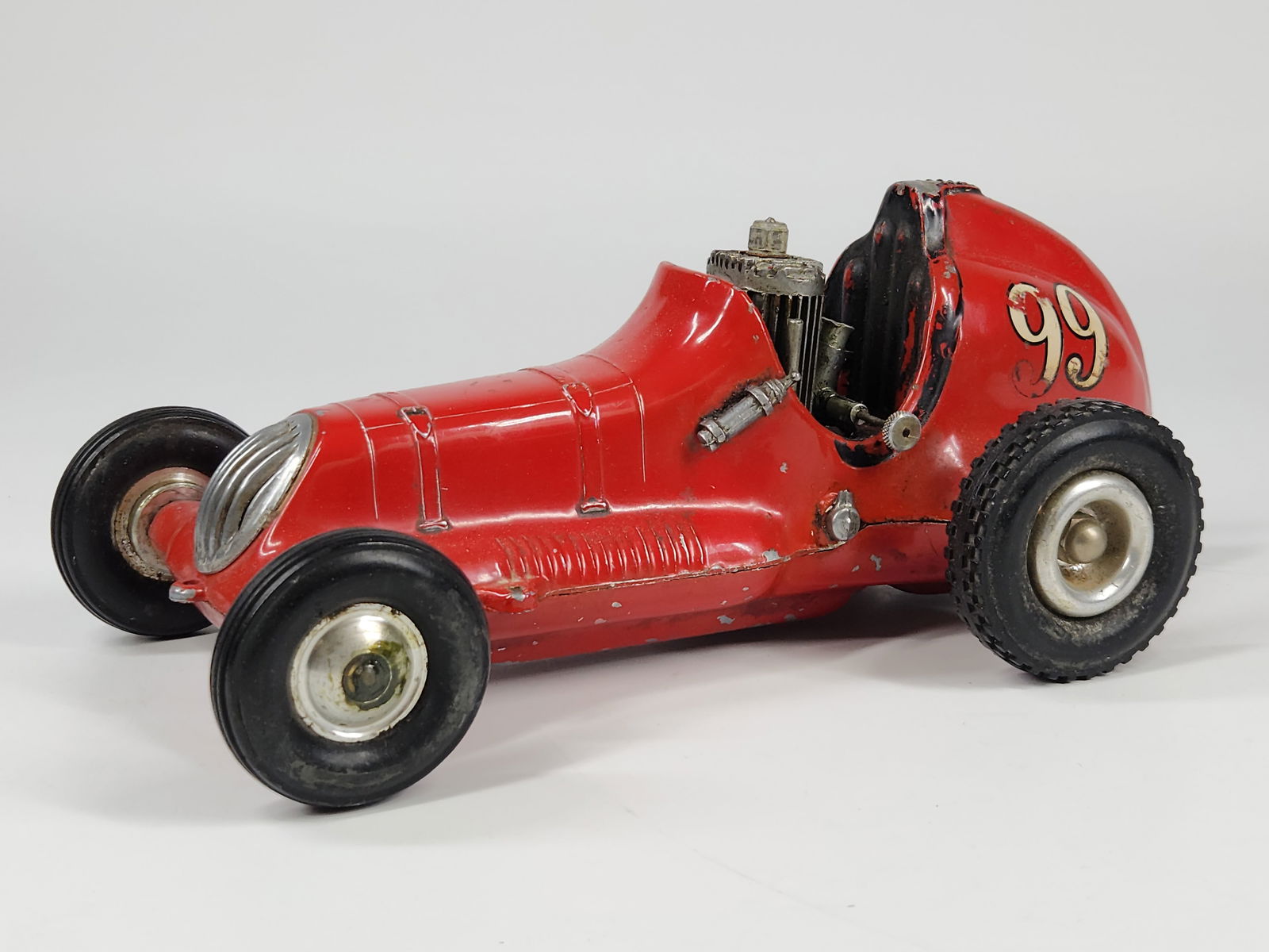 VINTAGE RAY COX THIMBLE DROME CHAMPION W/ ENGINE: REMAINS IN GOOD CONDITION, SHOWING SOME TYPICAL WEAR. INCLUDES ORIGINAL ENGINE, WHICH SHOWS USAGE WEAR. MEASURES APPROXIMATELY 9.5" LONG.