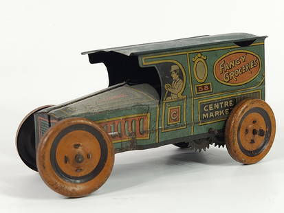 J. CHEIN TIN LITHO WIND UP FANCY GROCERIES: REMAINS IN FAIR TO GOOD CONDITION, SHOWING SOME TYPICAL WEAR. DUSTY.