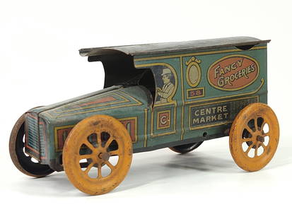 J. CHEIN TIN LITHO WIND UP FANCY GROCERIES: REMAINS IN FAIR TO GOOD CONDITION, SHOWING WEAR. MISSING WIND UP MECHANISM.