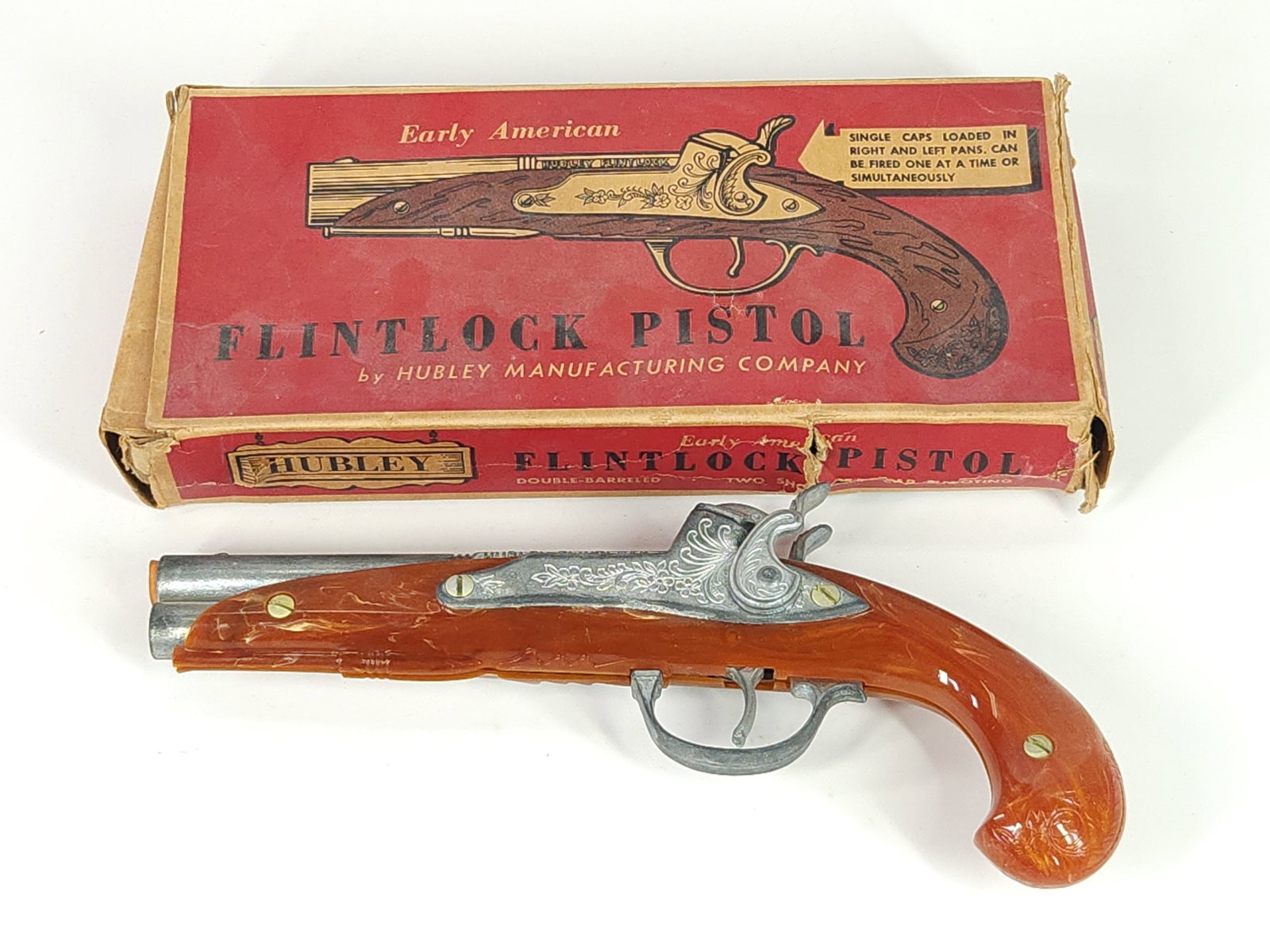 HUBLEY FLINTLOCK PISTOL W/ BOX: PISTOL REMAINS IN GOOD CONDITION, SHOWING SOME TYPICAL WEAR. BOX REMAINS IN FAIR CONDITION, SHOWING TEARS AND CREASES.